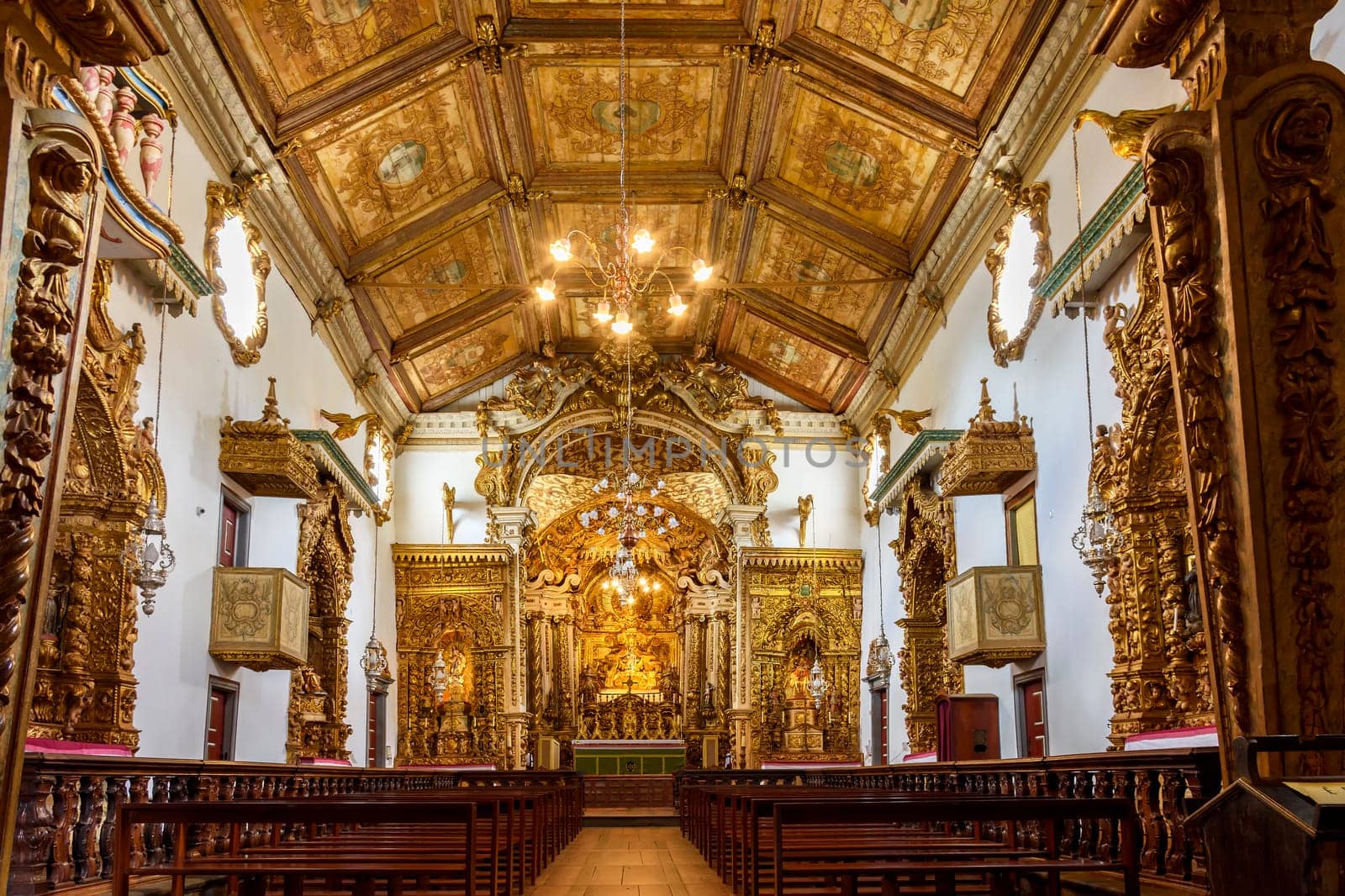 Interior and altar of a brazilian historic ancient church from the 18th century in baroque architecture with details of the walls in gold leaf in the city of Tiradentes, a UNESCO World Heritage Site, Minas Gerais State, Brazil