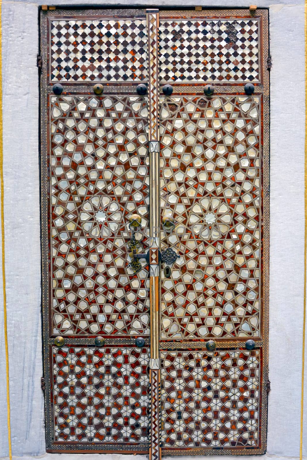 Portal with wood and mother-of-pearl mosaic inside the ancient and famous Topkapi Palace in Istanbul, Turkey