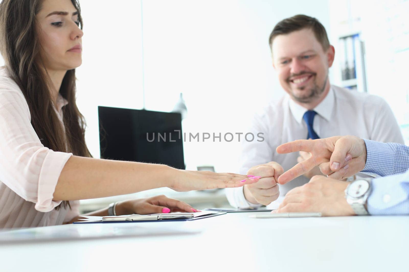 Funny business concept, businessman playing Rock Paper Scissors,. Plays at table during negotiations concept