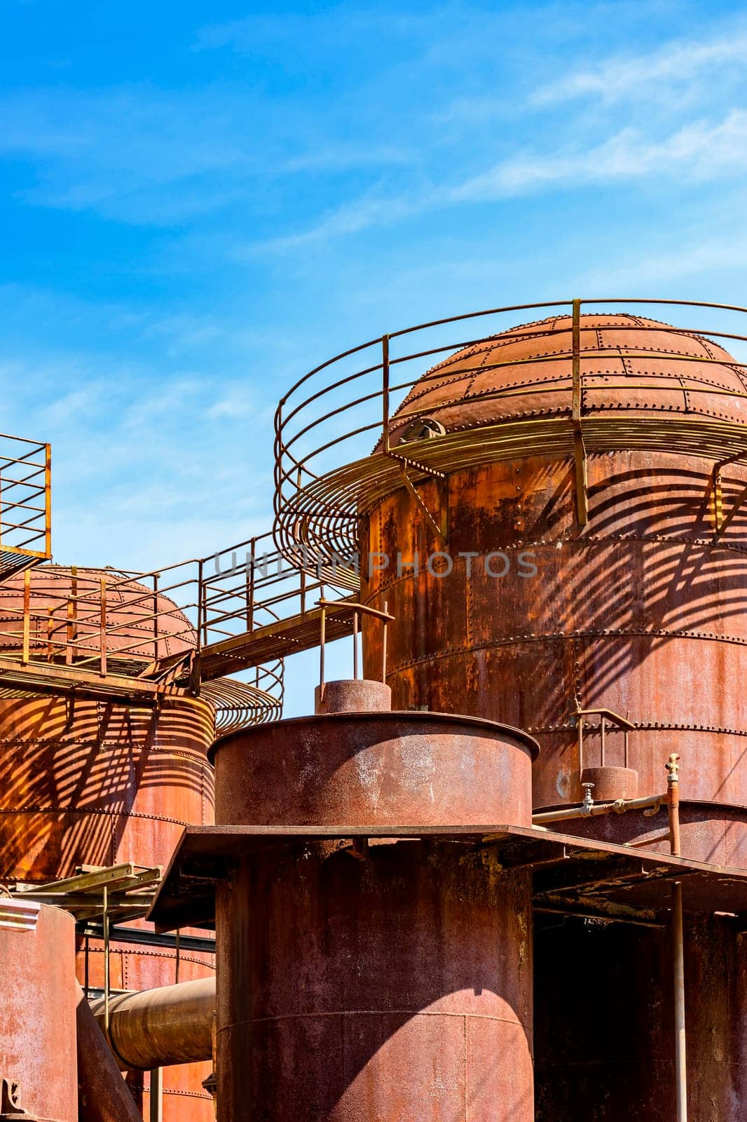 Old machinery tanks and infrastructure of an iron ore handling industry in the state of Minas Gerais, Brazil