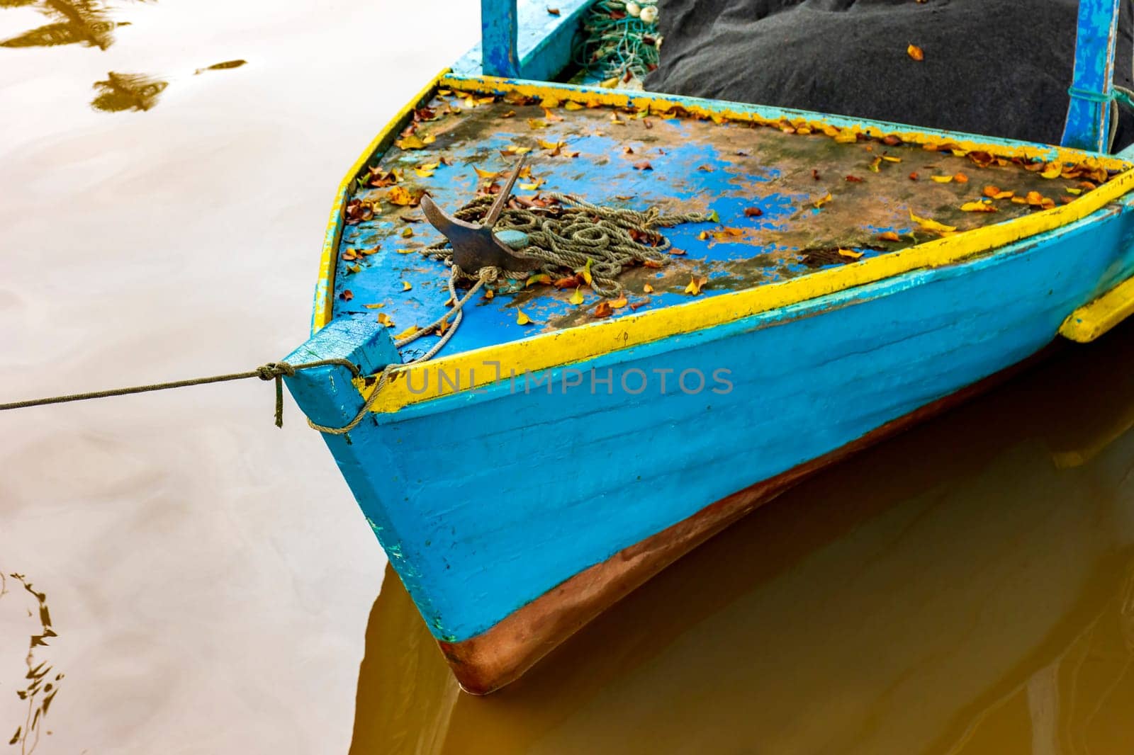 Rustic wooden fishing boat over the waters of the Paraty channel