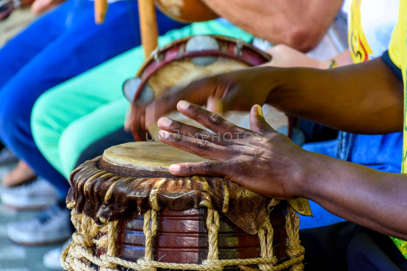 Percussion instrument called atabaque being played in traditional afro-brazilian capoeira presentation