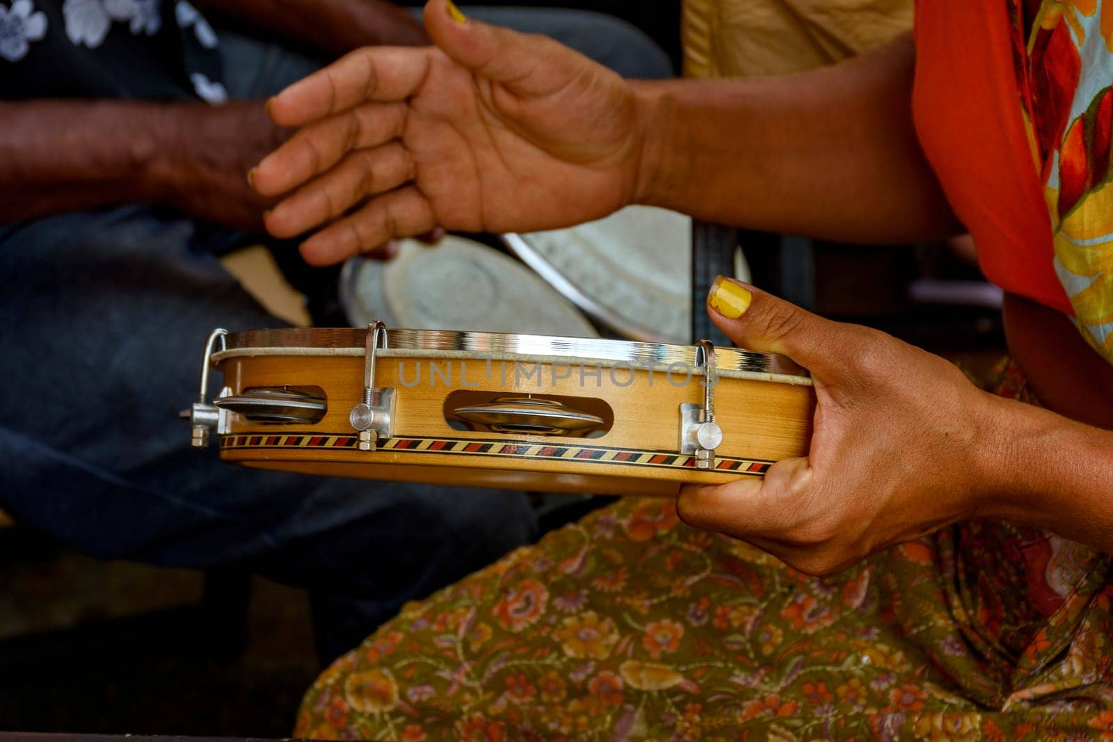 Tambourine being played by a ritimist during a samba performance in brazilian carnival in Rio de Janeiro, Brazil