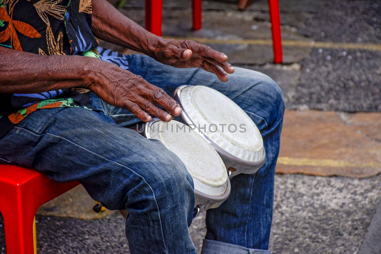 Percussionist playing bongo in the streets of historic Pelourinho district in Salvador, Bahia