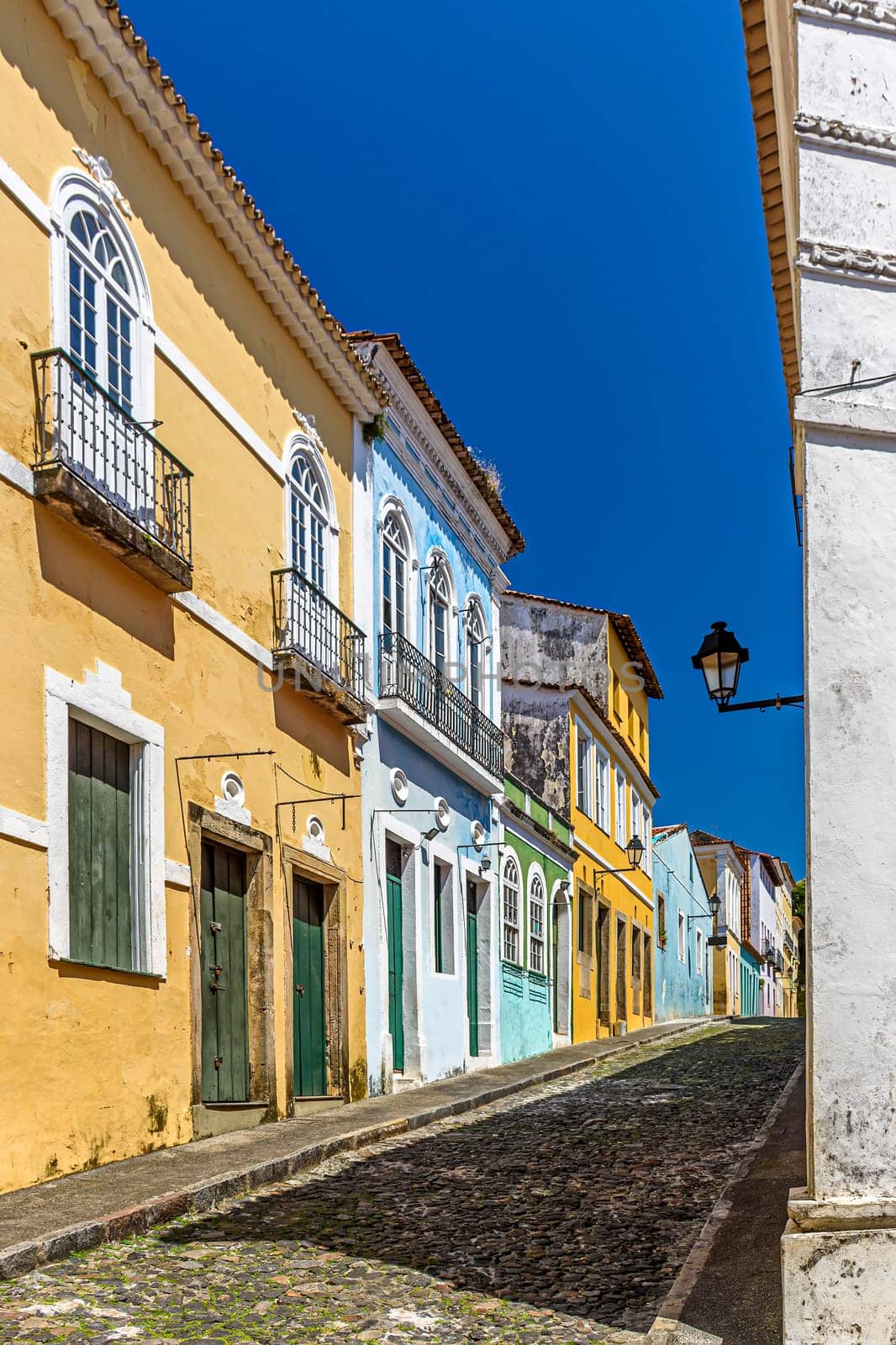 Cobbled streets and slopes and colorful colonial-style historic houses in the Pelourinho district of Salvador, Bahia