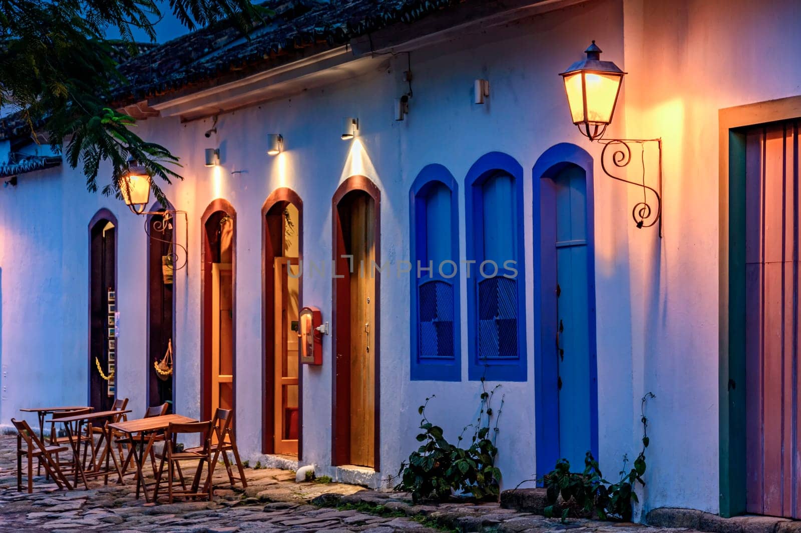 Street and colonial style houses illuminate at night in the city of Paraty on the coast of Rio de Janeiro, Brazil