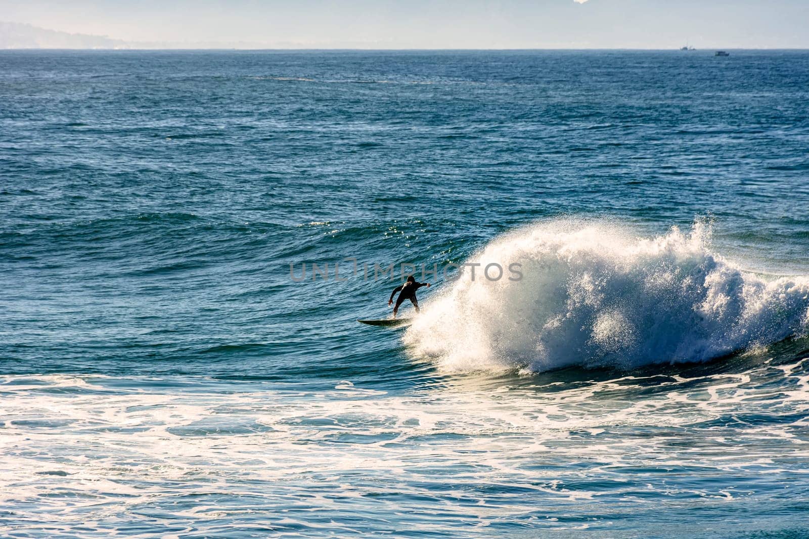 Surfer silhouette on Ipanema beach, Rio de Janeiro during the summer dawn.