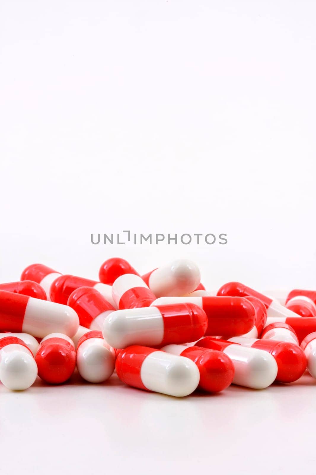 Various oval medicine pills on white background with free space