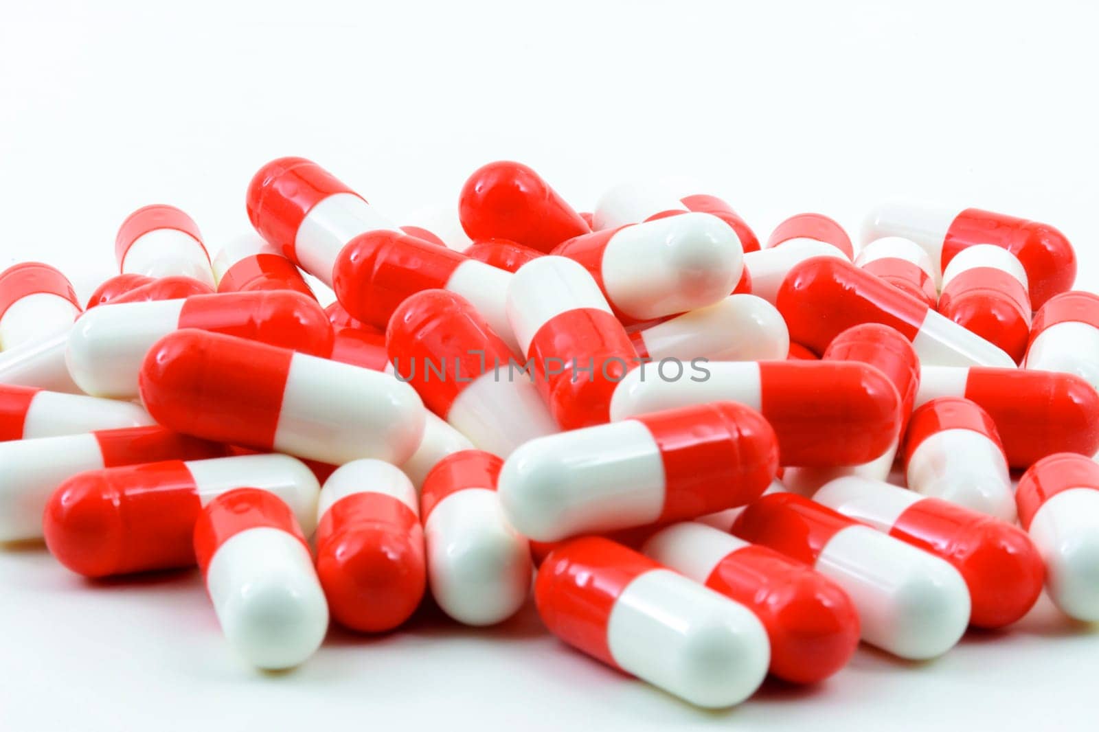 Several red and white pills by Fred_Pinheiro