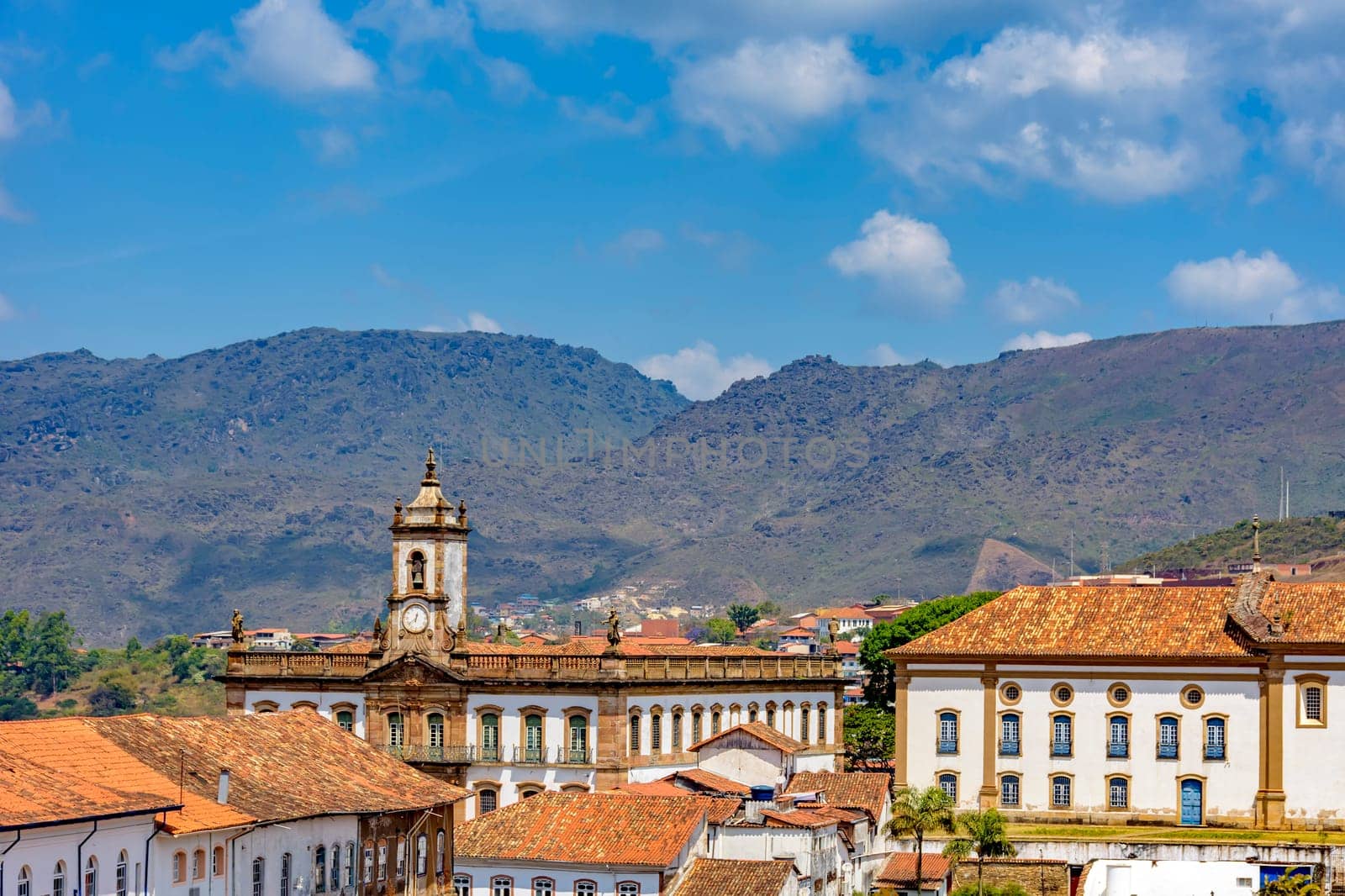 View from the top of the historic center of Ouro Preto with its houses, church, monuments and mountains