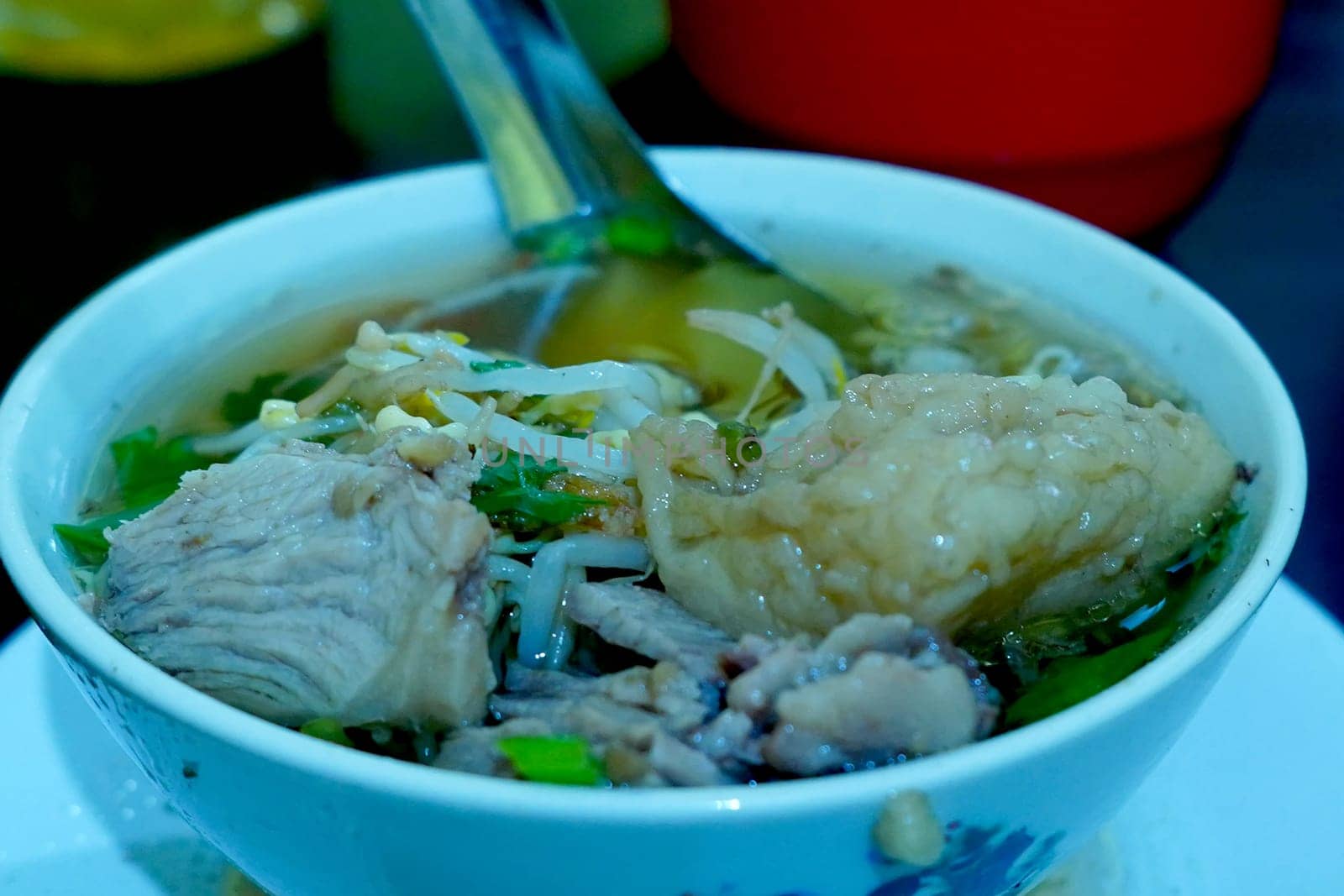 soto seger boyolali is a traditional beef soup with rice and sprouts served in a bowl.