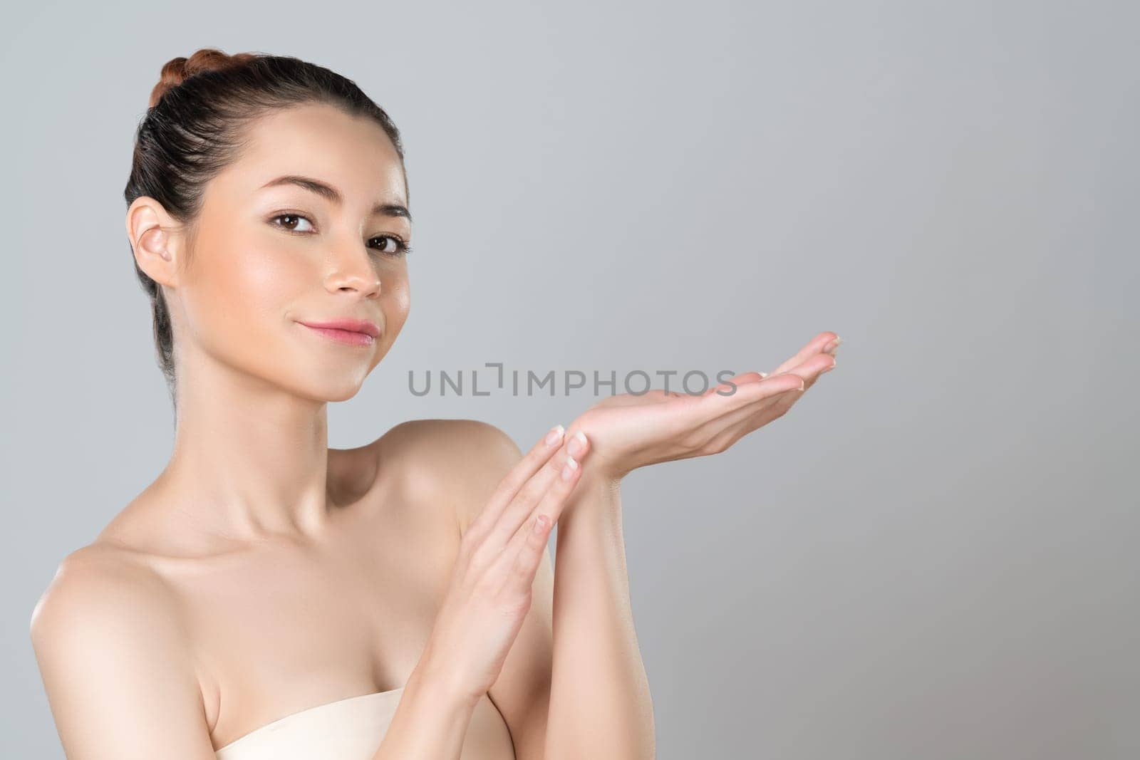 Glamorous beautiful woman with perfect smooth pure clean skincare with soft makeup in isolated background. Beauty hand gesture with expressive facial expression for advertising and indicate promotion.