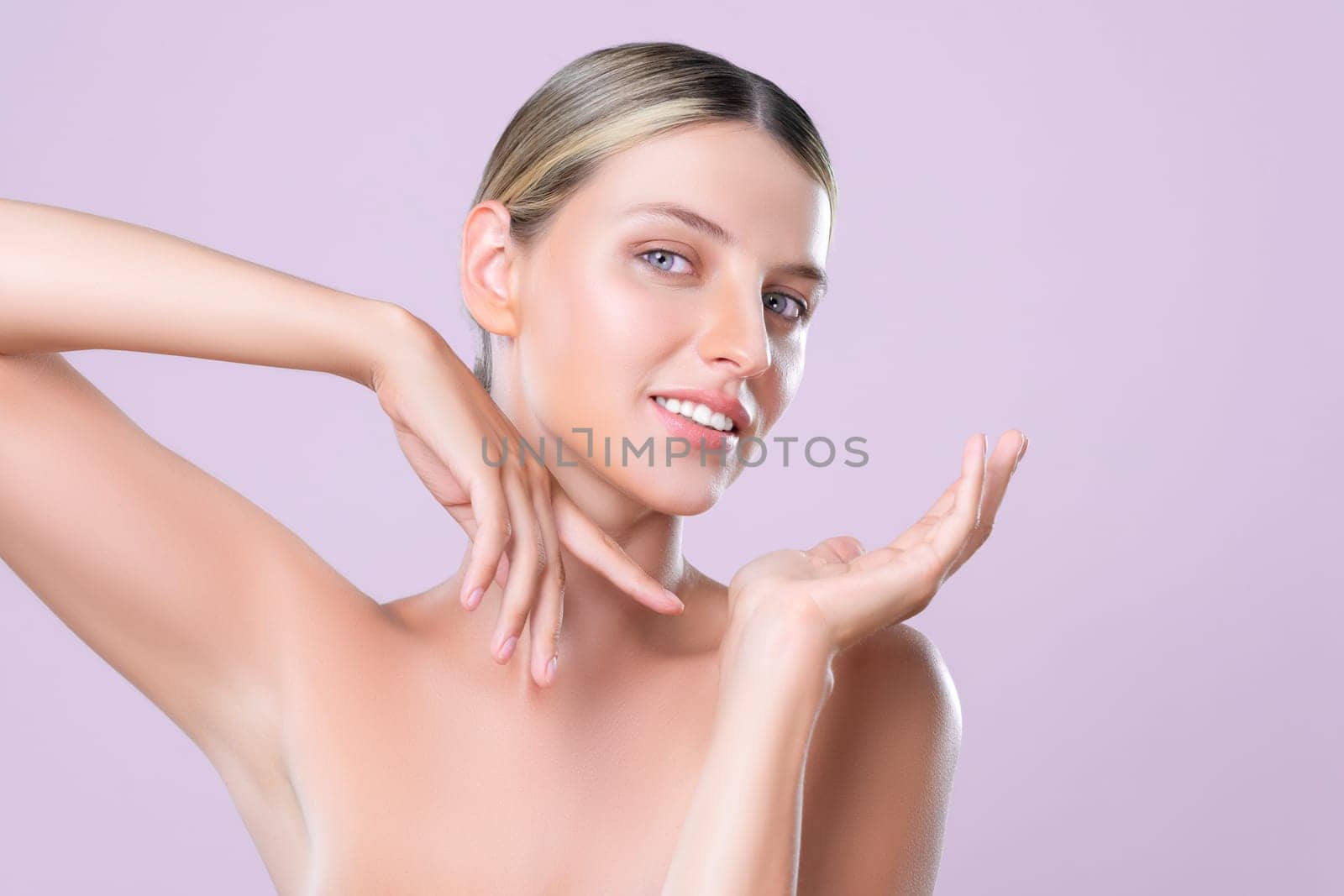 Alluring beautiful woman with perfect smooth and clean skin portrait in isolated background. Beauty hand gesture with expressive facial expression for skincare treatment product or spa.