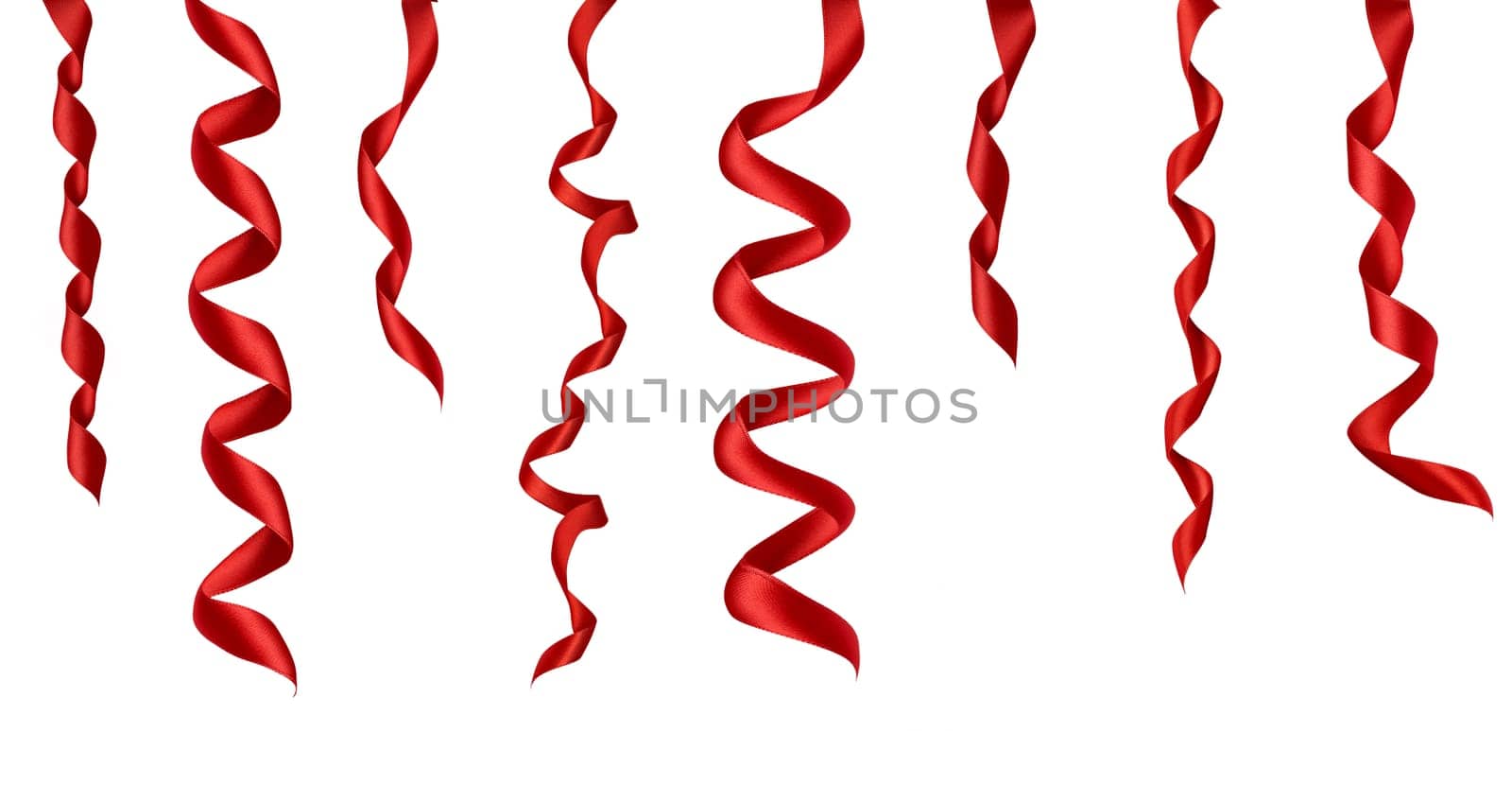 collection of various red ribbon pieces on white background. each one is shot separately