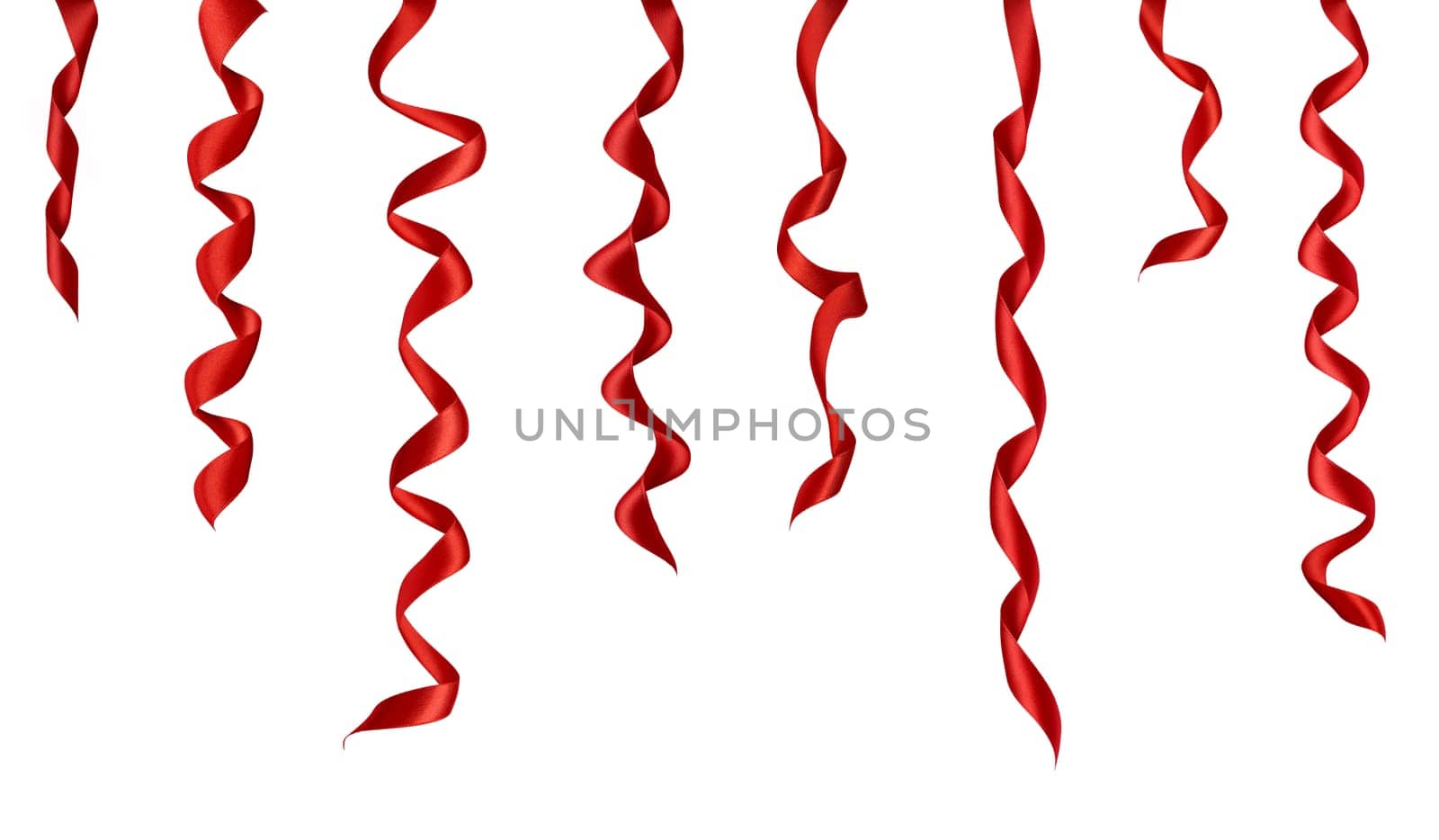 collection of various red ribbon pieces on white background. each one is shot separately