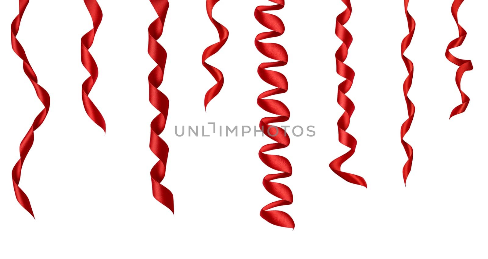 collection of various red ribbon pieces on white background. each one is shot separately