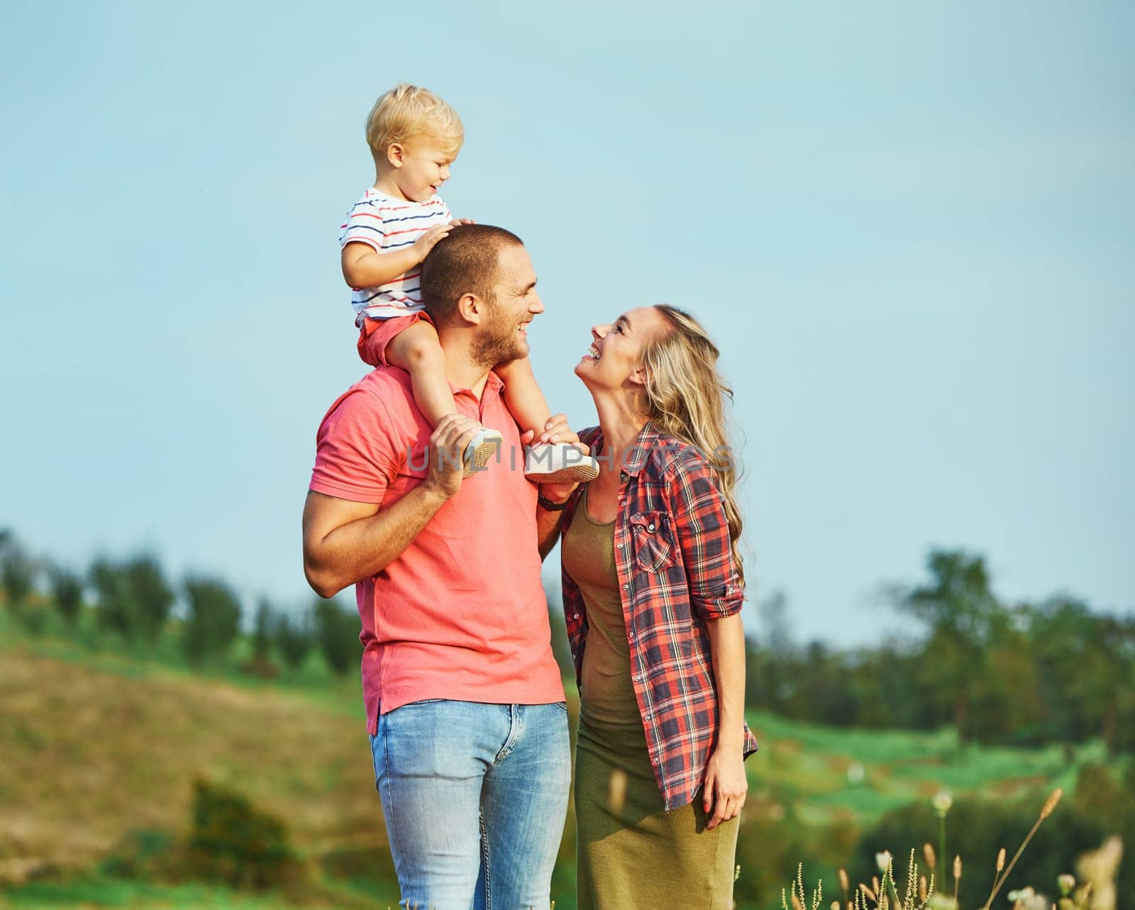 Portrait of a young happy family having fun outdoors