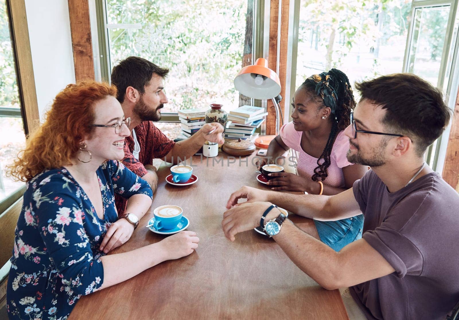 Group of young happy people friend having fun in a coffee shop