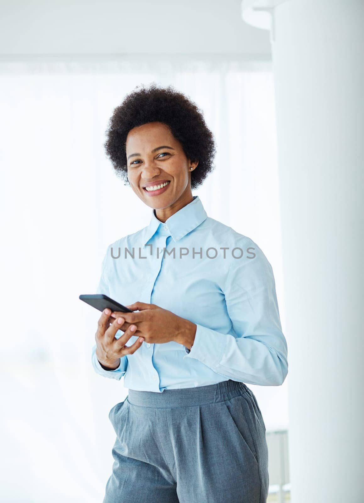 business woman black african american portrait office executive smartphone happy smiling mobile phone by Picsfive