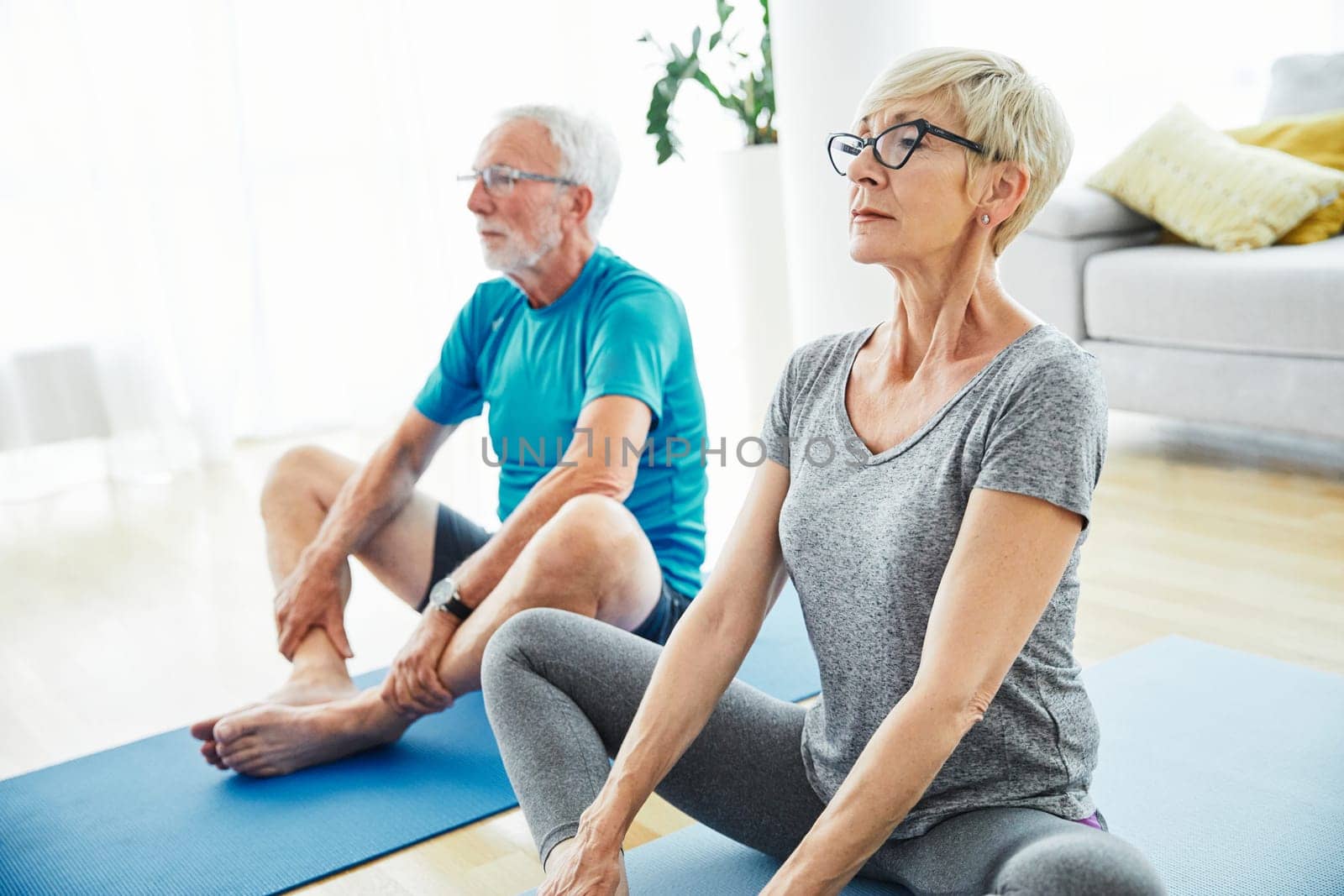 Senior couple exercise together at home health care