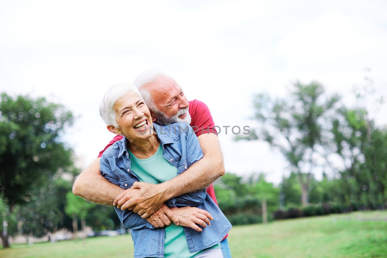 senior couple happy elderly love together retirement lifestyle smiling man woman mature fun by Picsfive