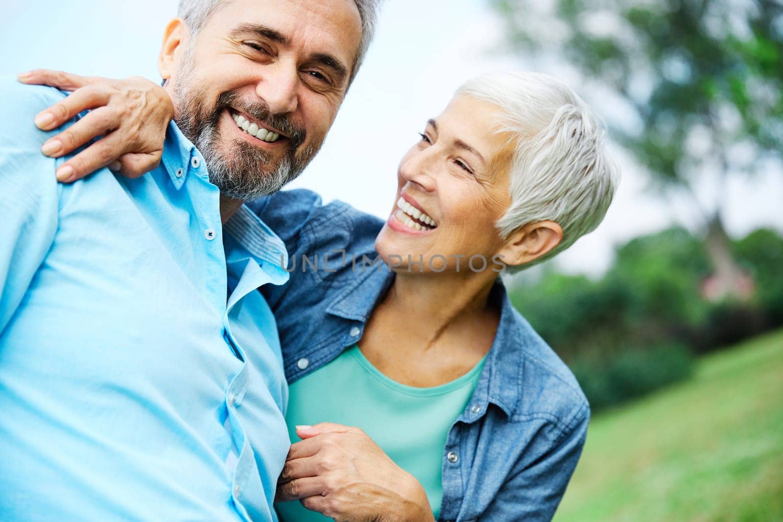 portrait of happy smiling senior couple outdoors