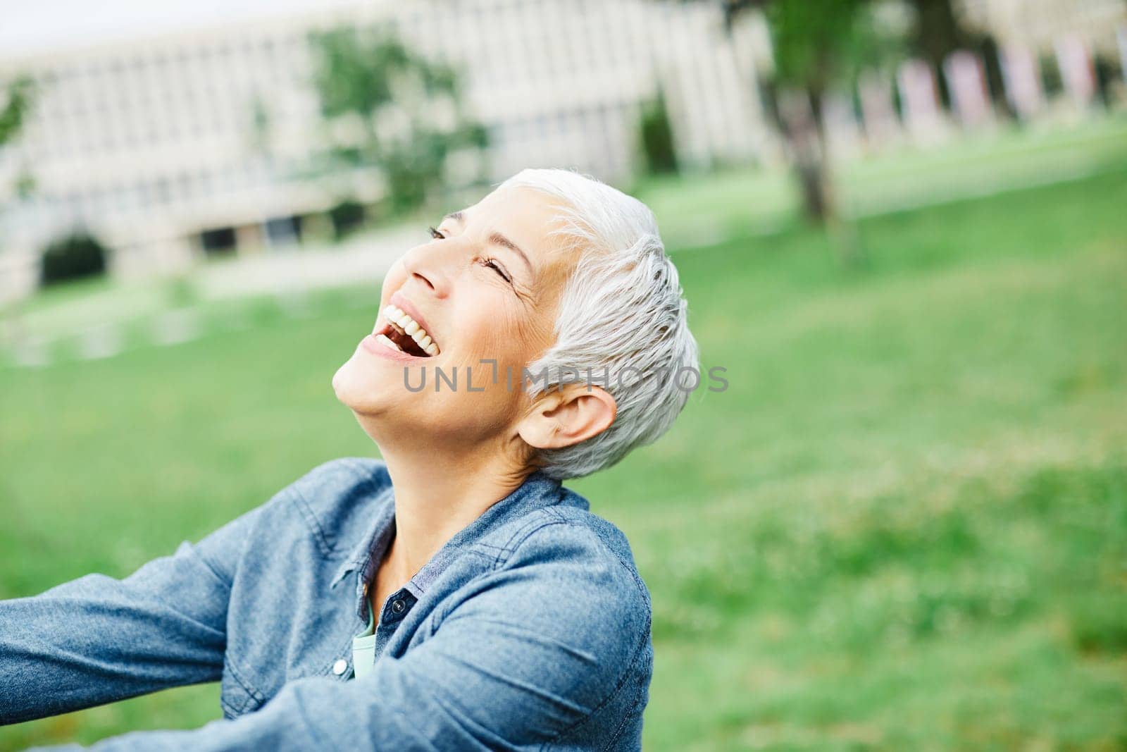portrait of happy smiling senior woman outdoors
