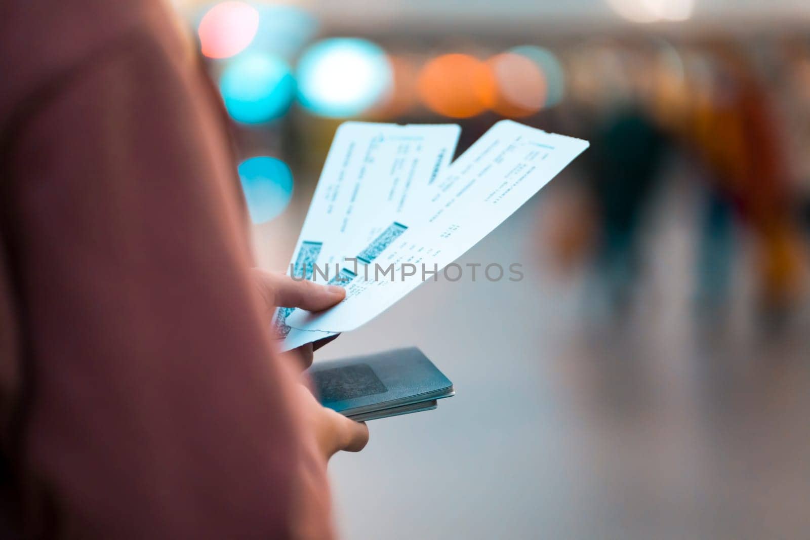 Girl holds tickets, boarding passes for a flight. by africapink