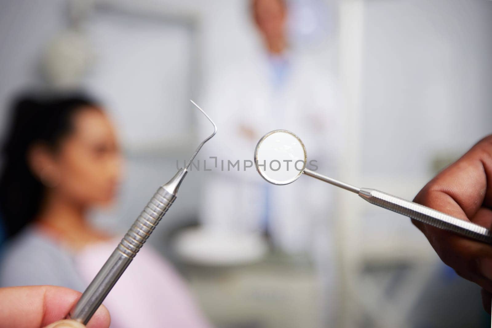 The countdown to zero cavities. an unrecognisable dentist holding dental tools in an office