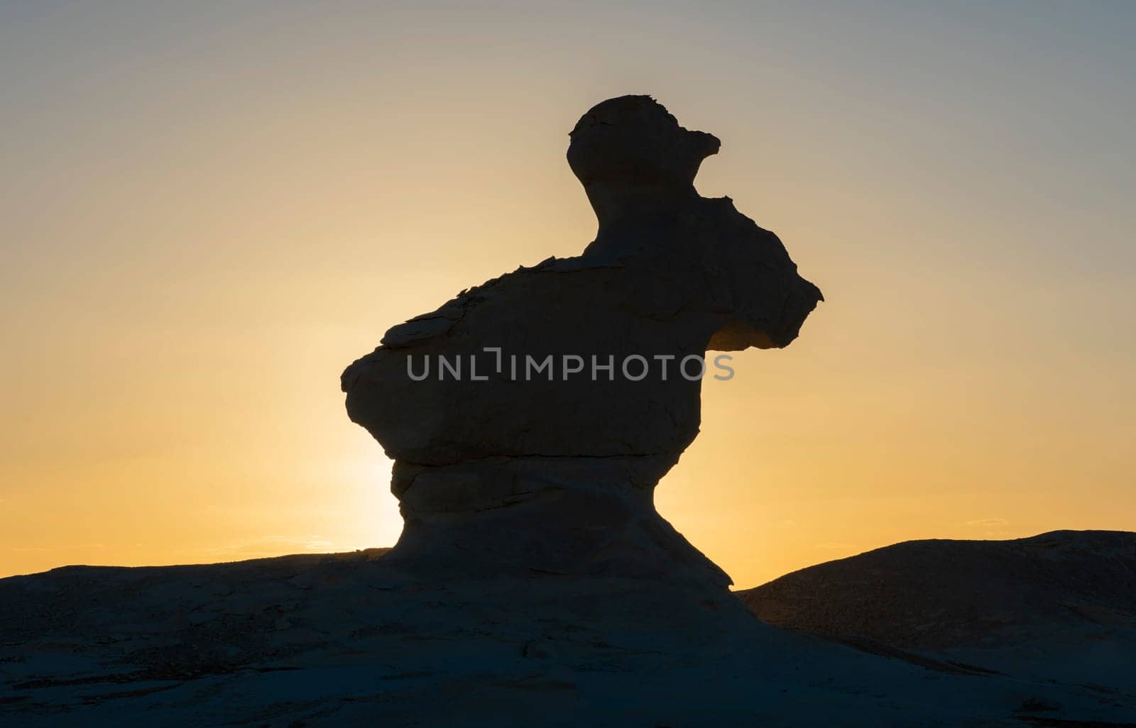 Landscape scenic view of desolate barren western desert in Panoramic barren landscape in Egypt Western White desert with silhouette of geological rock formations