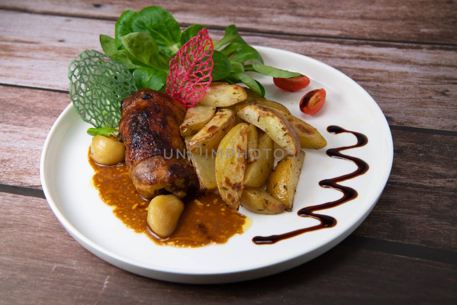 Recipe for boneless rolled chicken leg with potatoes and molasses-flavoured mache salad, High quality photo
