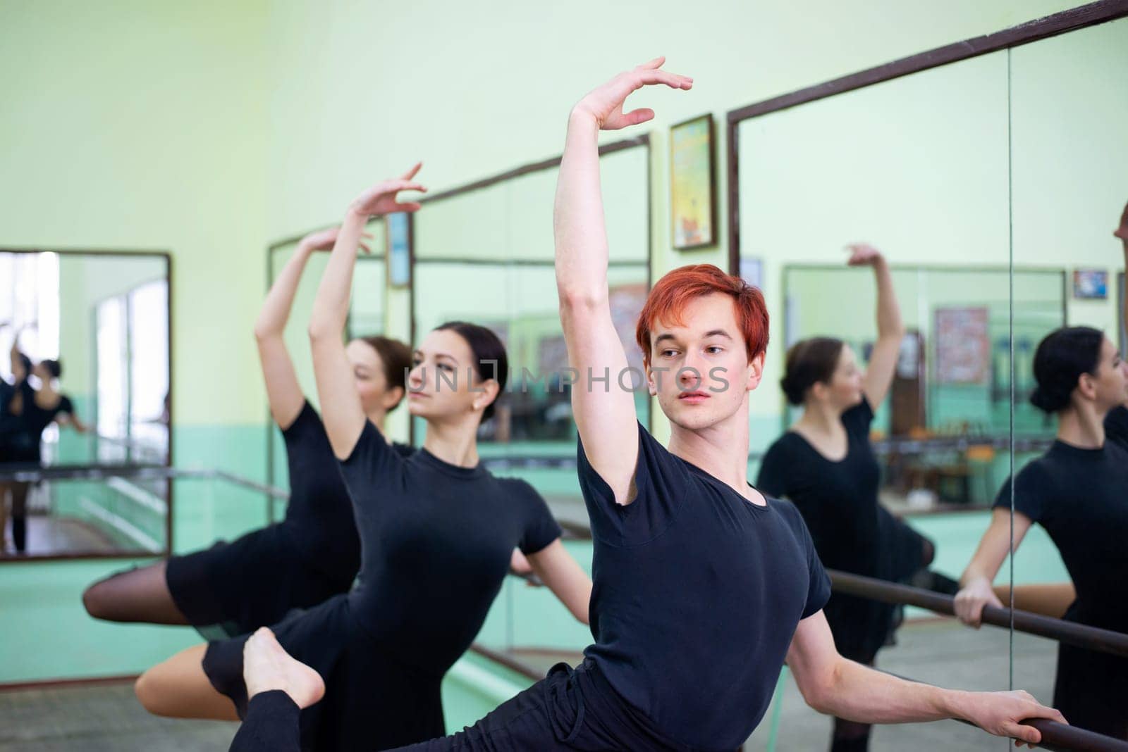 Professional dancers preparing for a next performance on stage, training together in conventional dancing hall