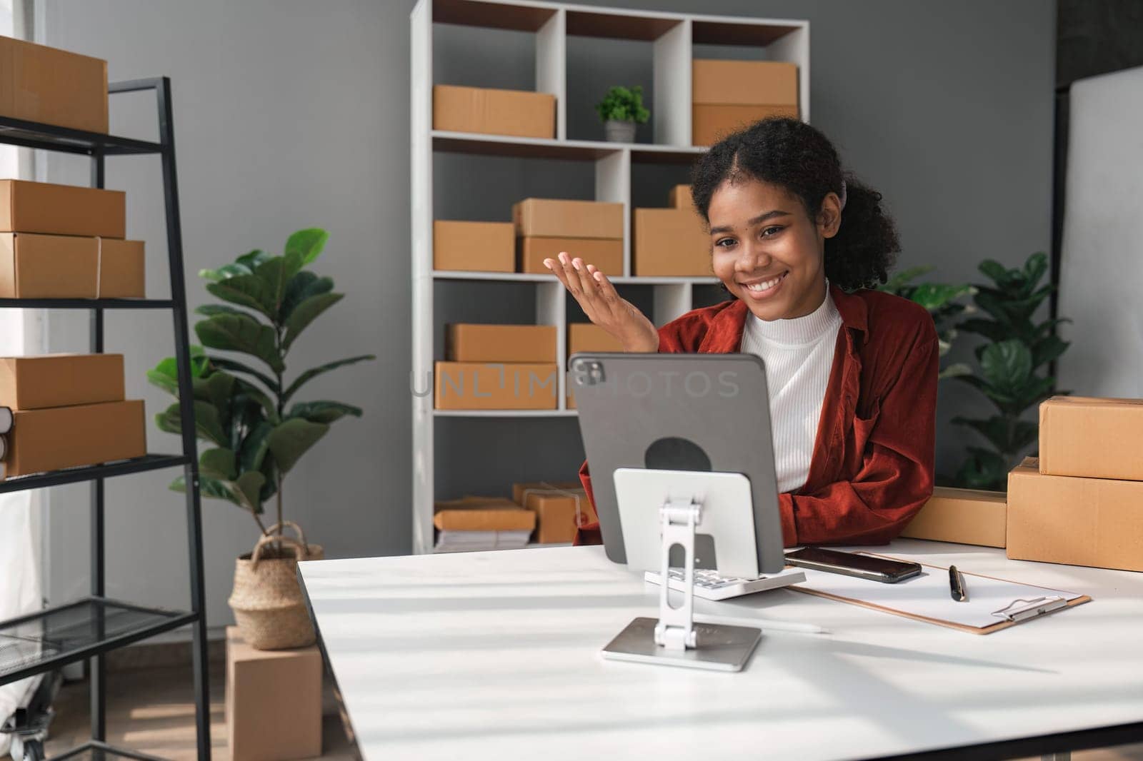 Beautiful African Americans woman live streaming at her shop. Business online influencer on social media concept. Online Selling. Online Shopping.