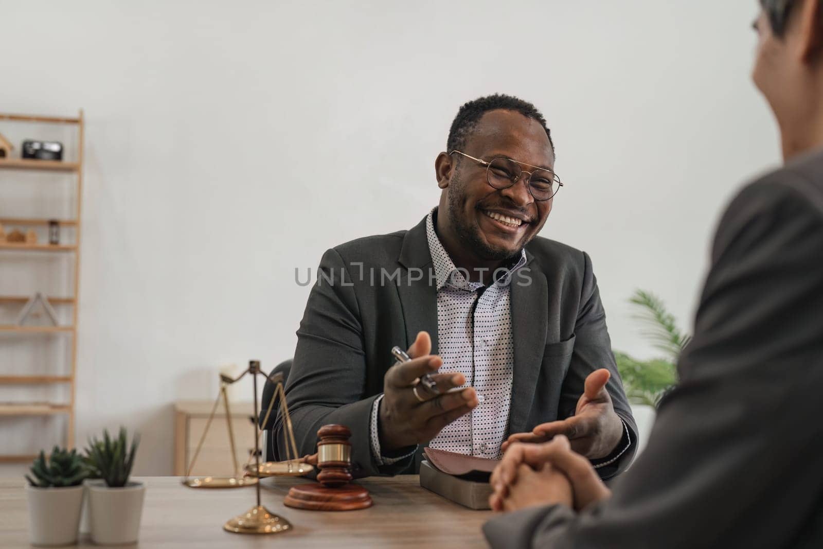 Business team and lawyers discussing contract papers sitting at the table. Concepts of law, advice, legal services. at office..