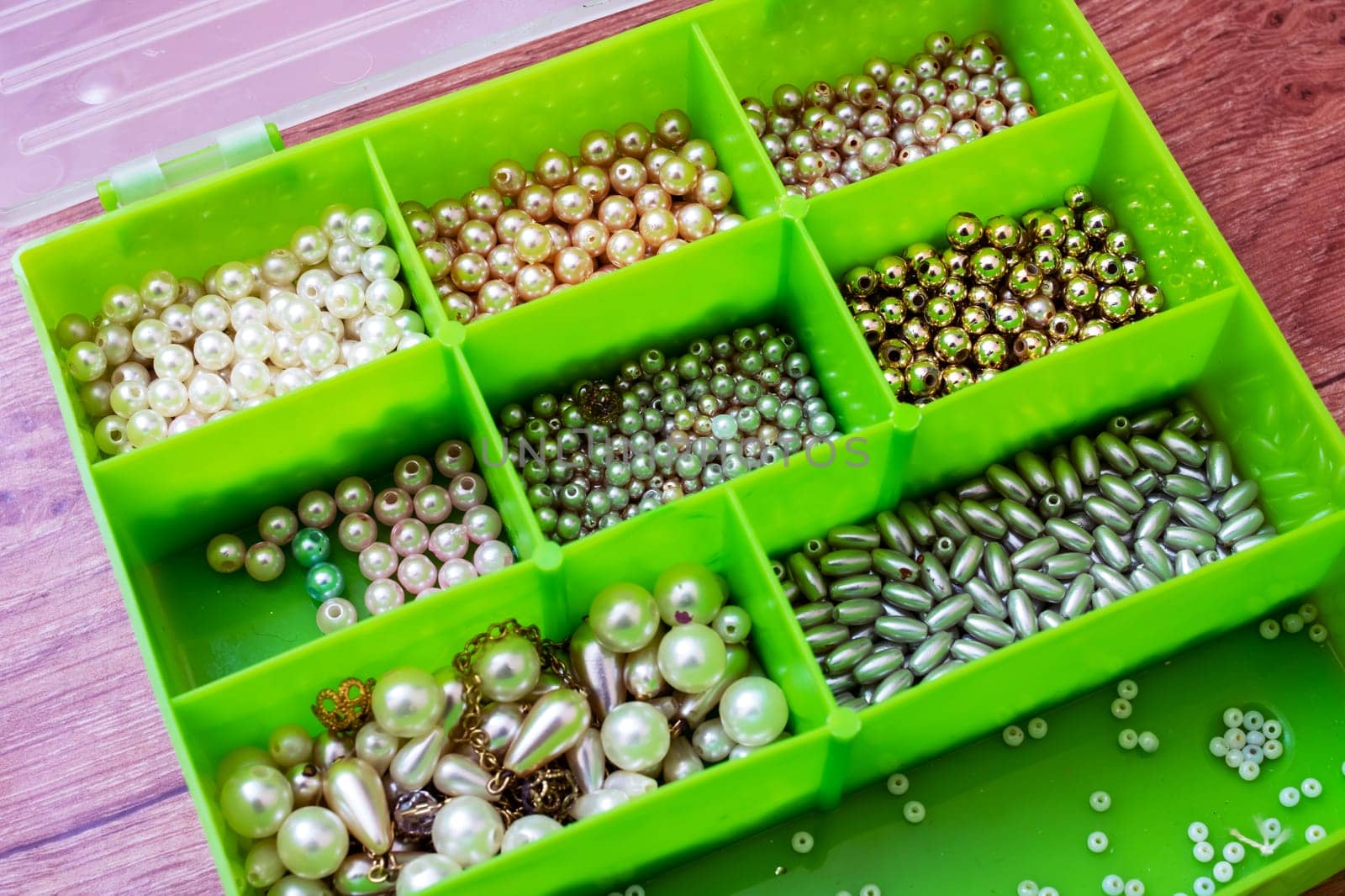Colorful beads in containers close up, handicrafts, macrophoto