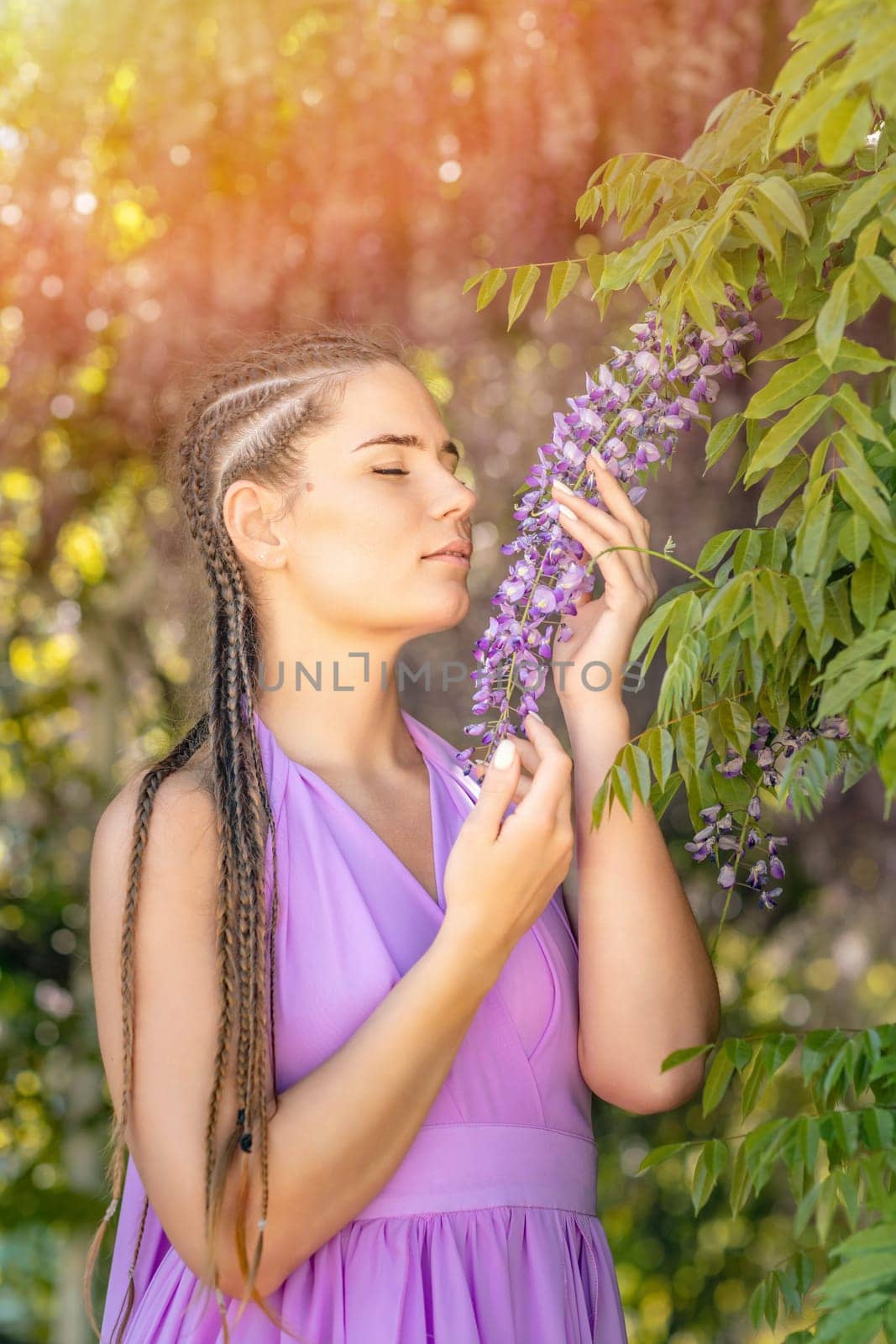 Woman wisteria lilac dress. Thoughtful happy mature woman in pur by Matiunina