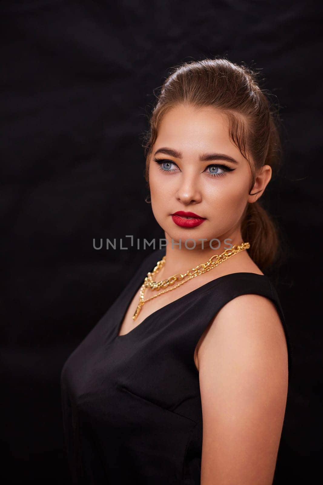 portrait shot of a young Ukrainian woman on the background, after make-up and hairstyle, for clothing advertising.