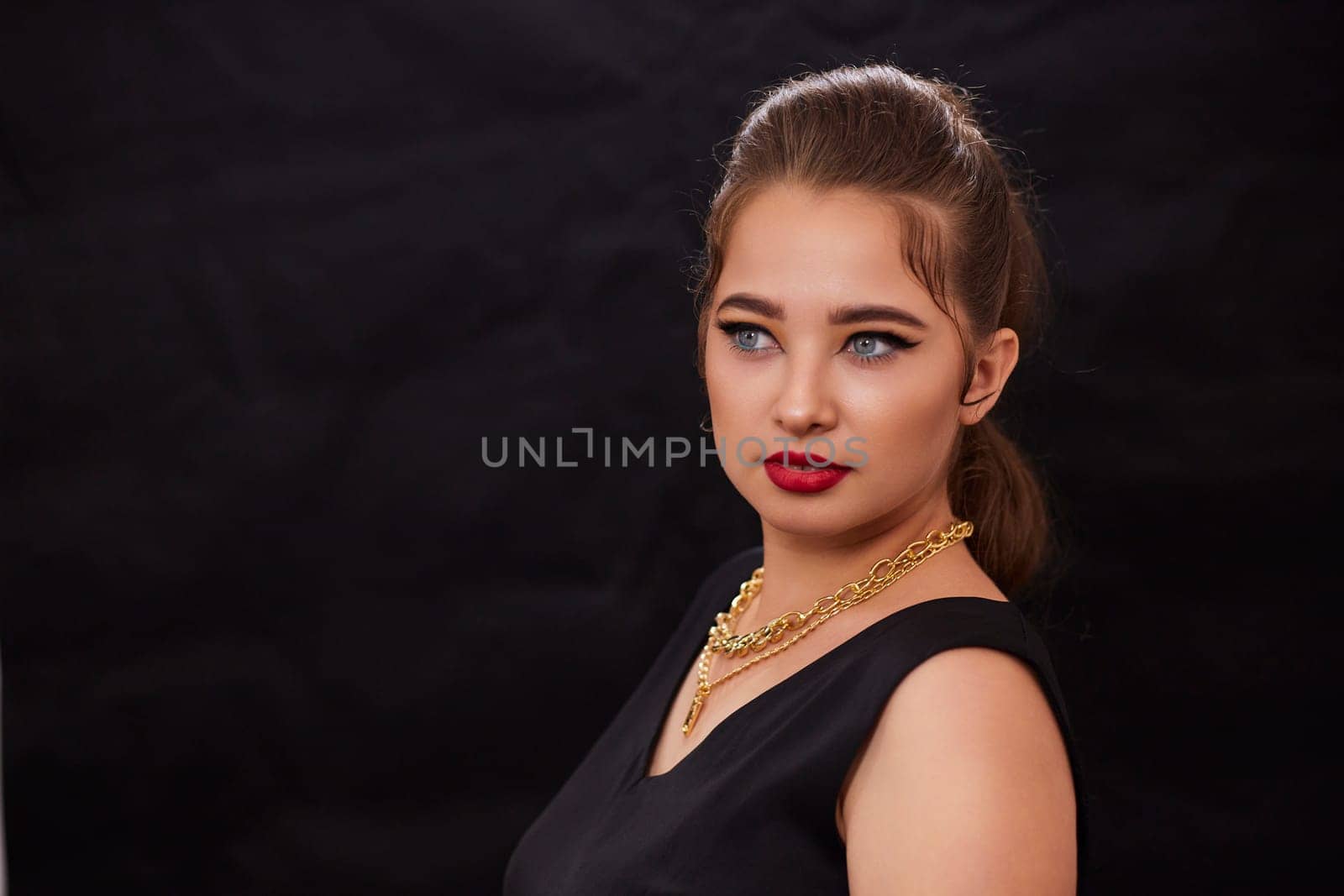 portrait shot of a young Ukrainian woman on the background, after make-up and hairstyle, for clothing advertising.