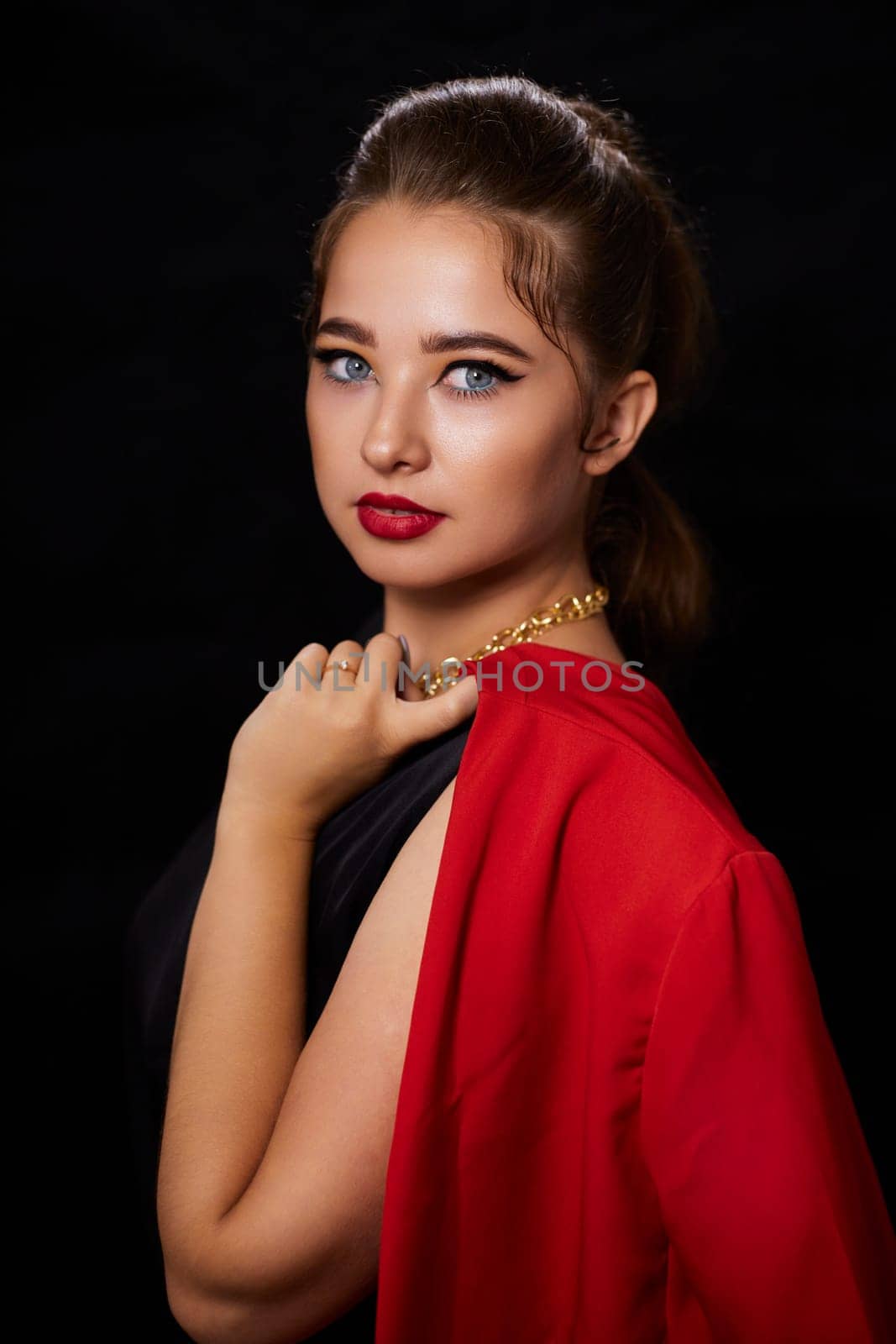 portrait shot of a young Ukrainian woman on the background, after make-up and hairstyle, for clothing advertising.