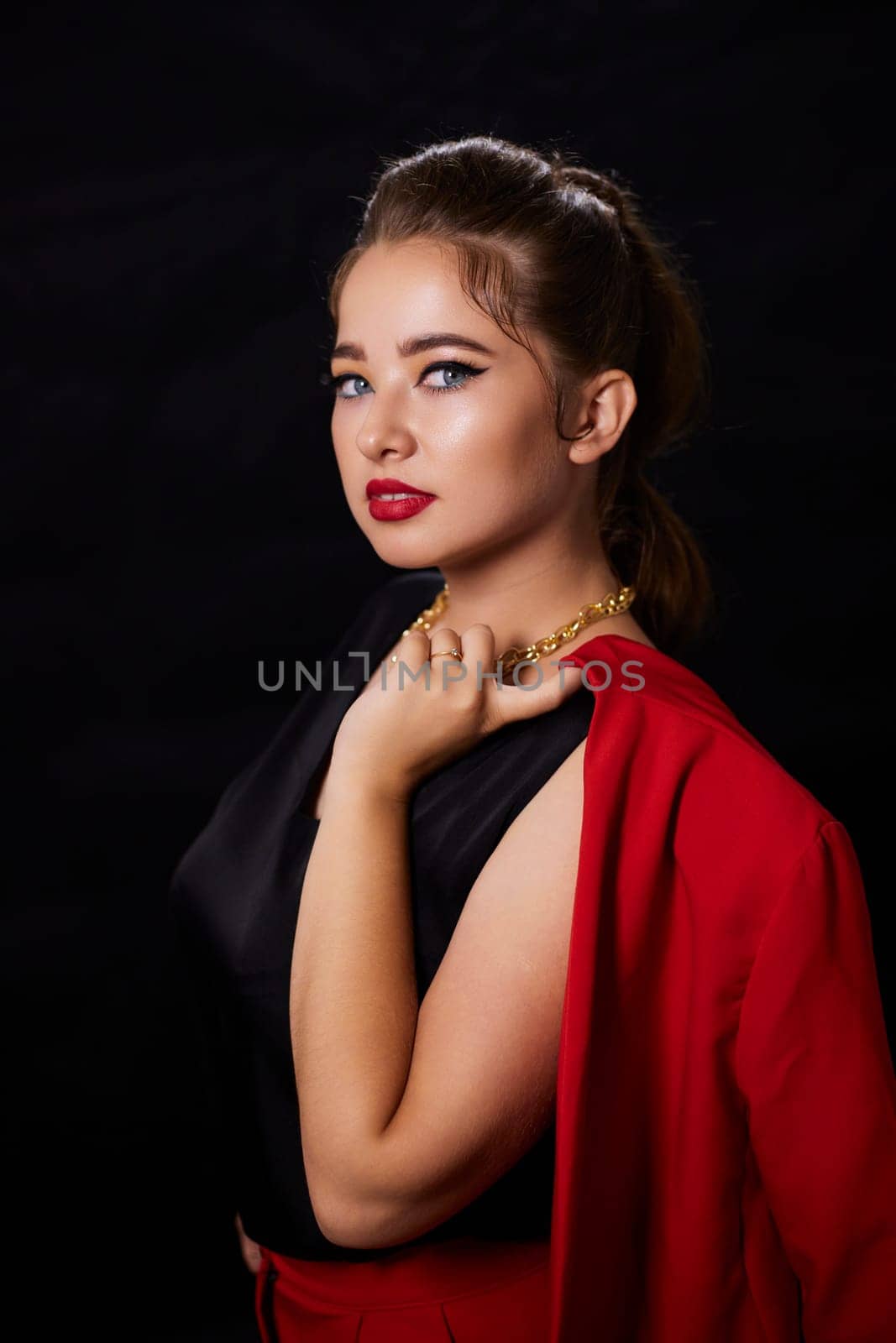 portrait shot of a young Ukrainian woman on the background, after make-up and hairstyle, for clothing advertising.