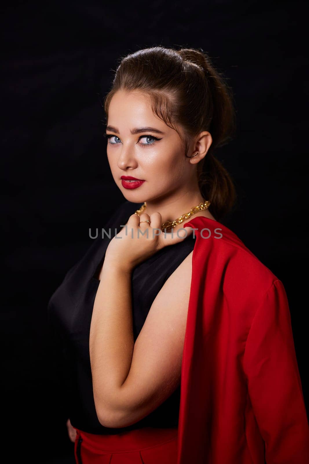 portrait shot of a young Ukrainian woman on the background, after make-up and hairstyle, for clothing advertising.