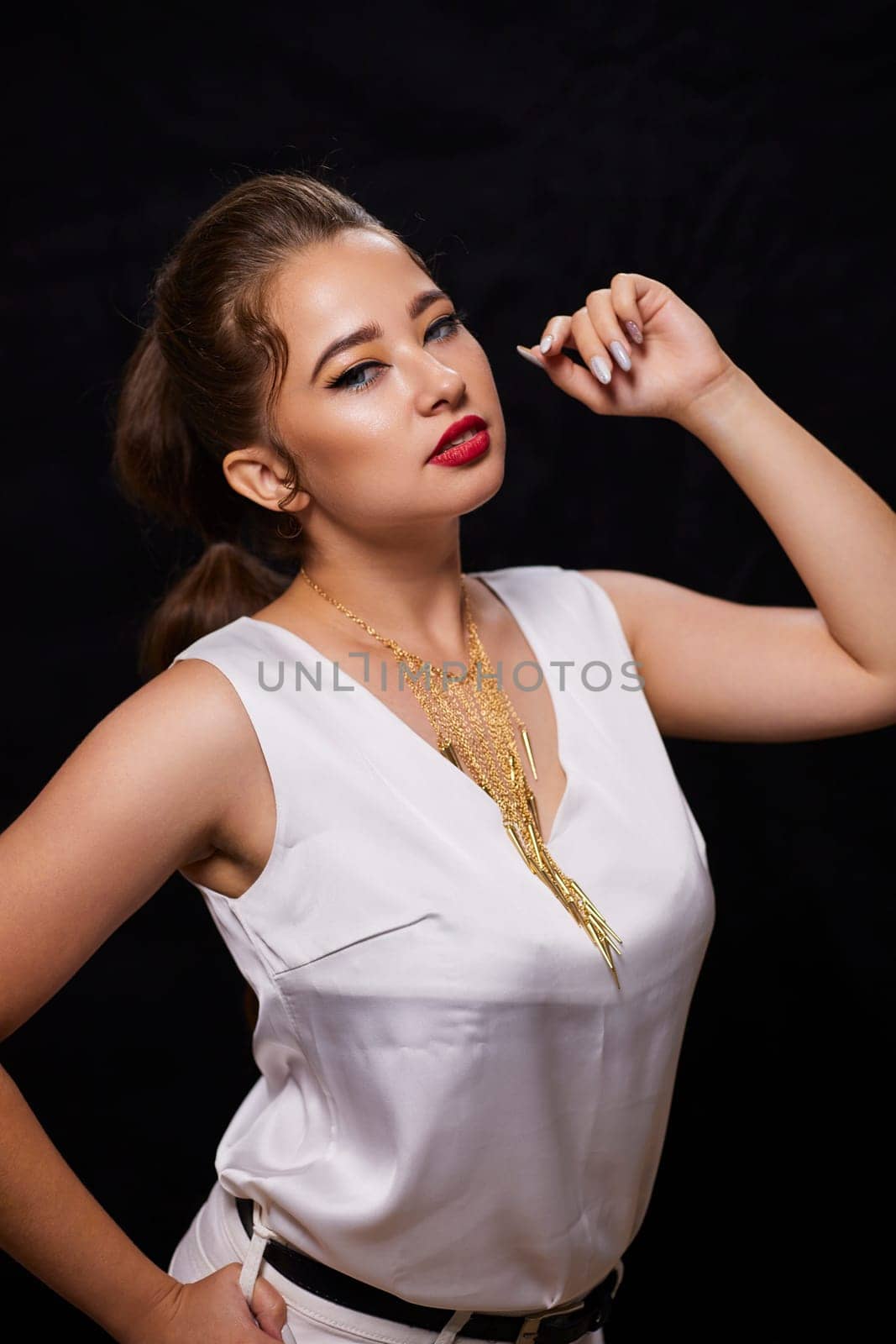 portrait shot of a young Ukrainian woman on the background, after make-up and hairstyle, for clothing advertising.