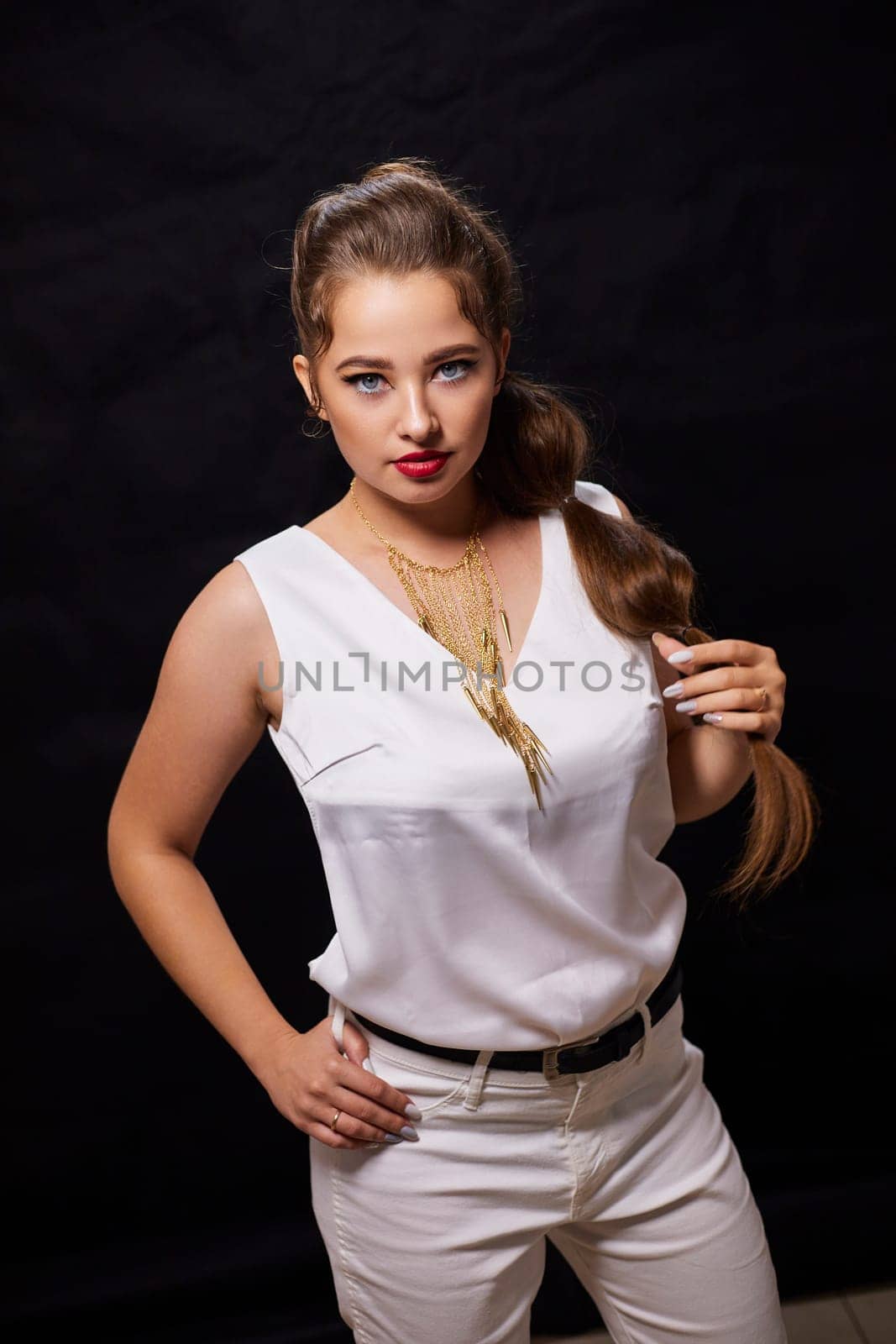 portrait shot of a young Ukrainian woman on the background, after make-up and hairstyle, for clothing advertising.