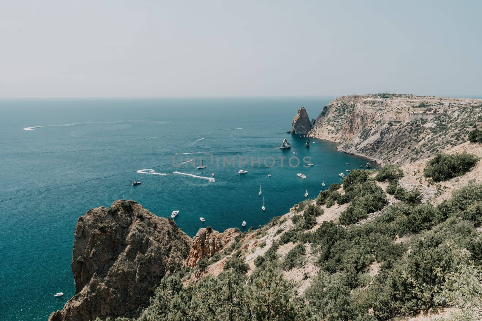 Sea lagoon. Panoramic view on calm azure sea and volcanic rocky by panophotograph