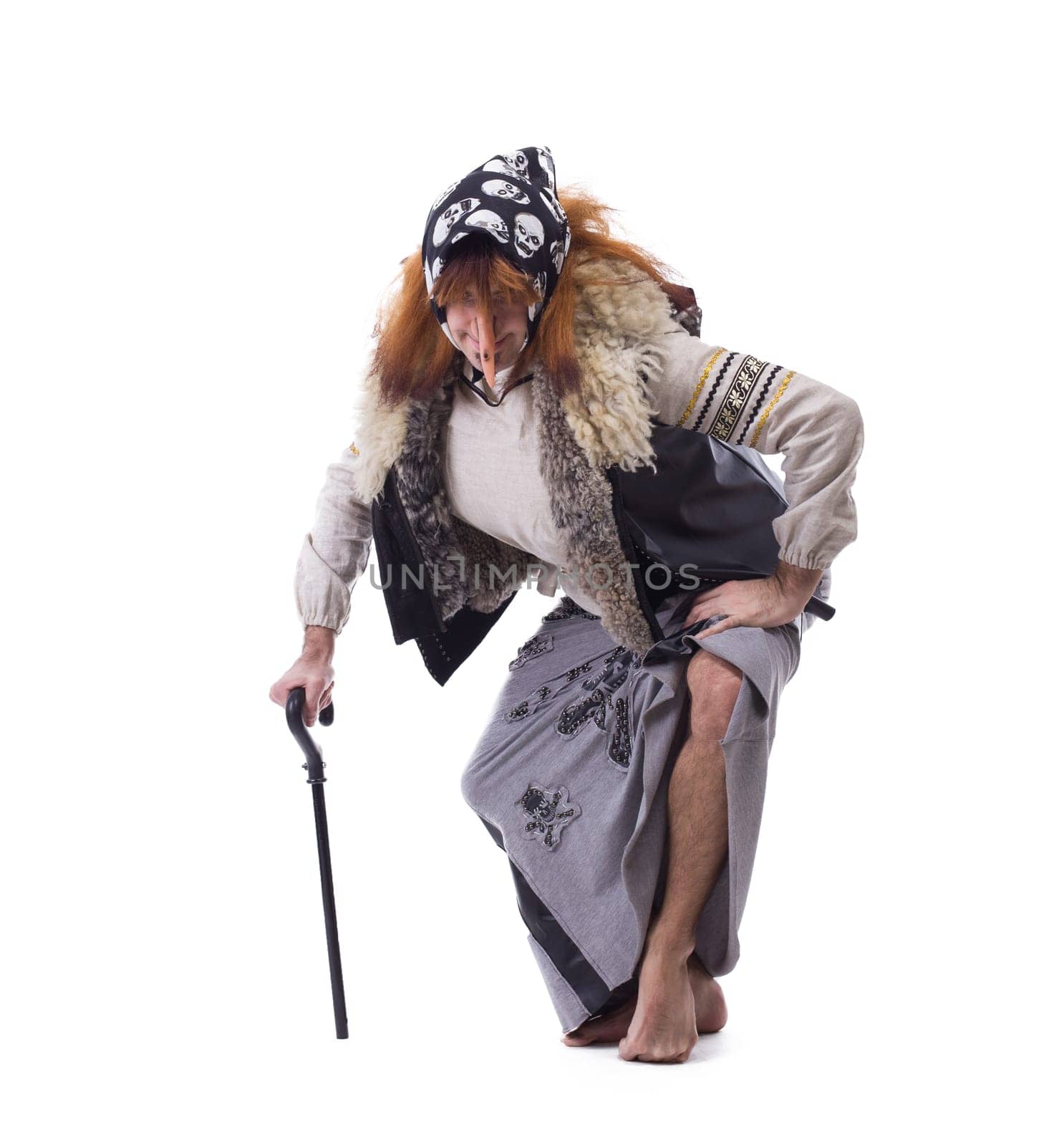 Baba Yaga in old clothes. Isolated on white