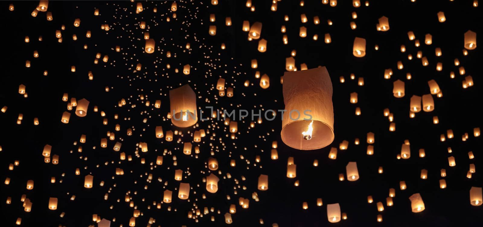 Tourist floating sky lanterns in Loy Krathong festival , Chiang Mai ,Thailand.