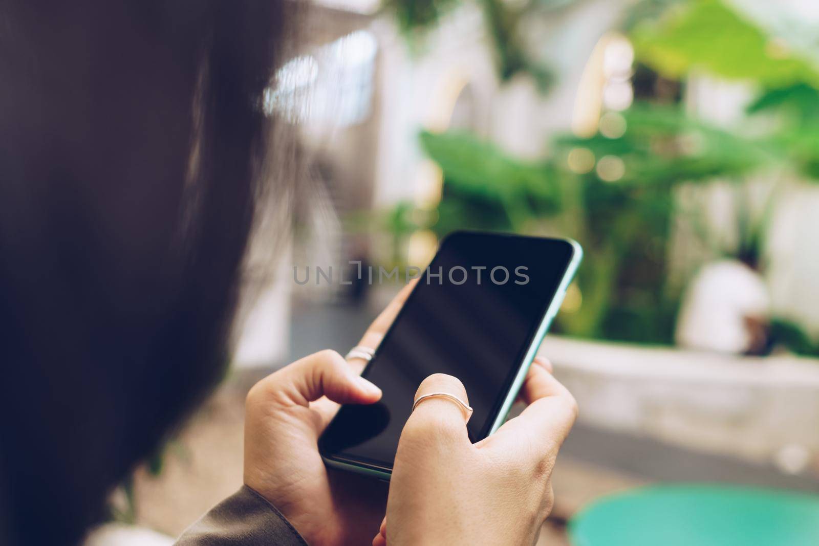 Woman hand using smartphone to do work business, social network, communication. by Suwant