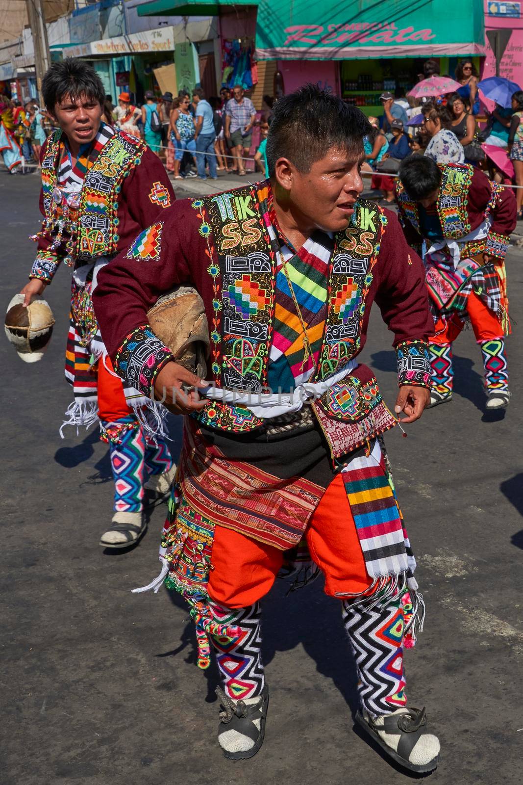 ARICA, CHILE - JANUARY 22, 2016: Tinkus dancing group in colourful costumes performing a traditional ritual dance as part of the Carnaval Andino con la Fuerza del Sol in Arica, Chile.