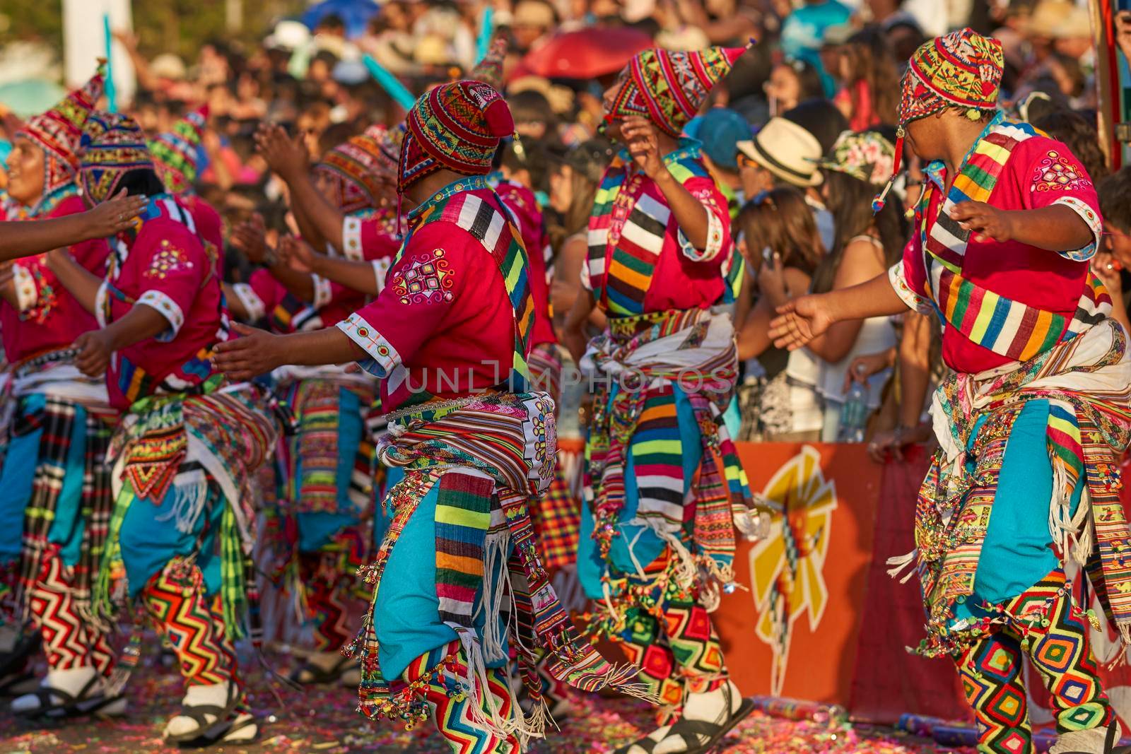 Arica, Chile - January 23, 2016: Tinkus dancing group in colourful costumes performing a traditional ritual dance as part of the Carnaval Andino con la Fuerza del Sol in Arica, Chile.