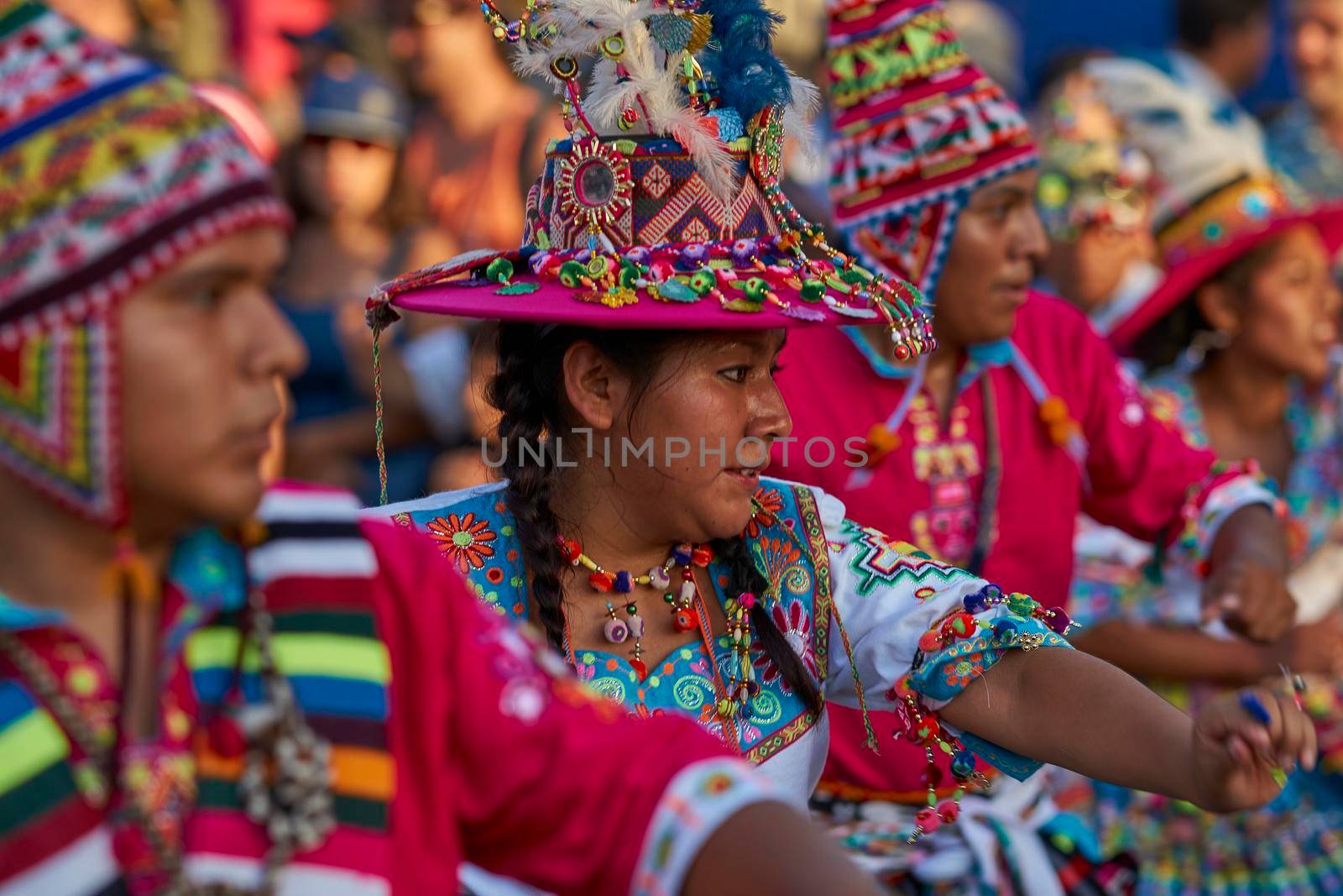 Arica, Chile - January 23, 2016: Tinkus dancing group in colourful costumes performing a traditional ritual dance as part of the Carnaval Andino con la Fuerza del Sol in Arica, Chile.